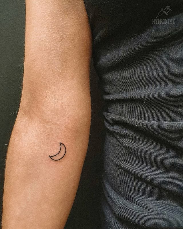 Sun and moon tattoo on the wrist