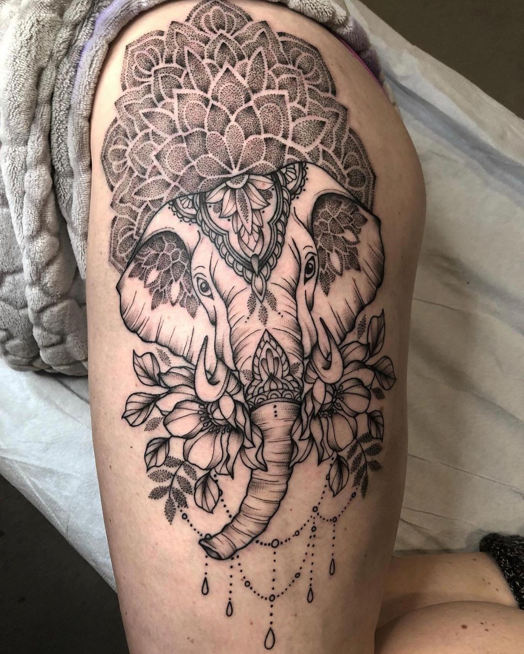 Realistic elephant tattoo on the right thigh
