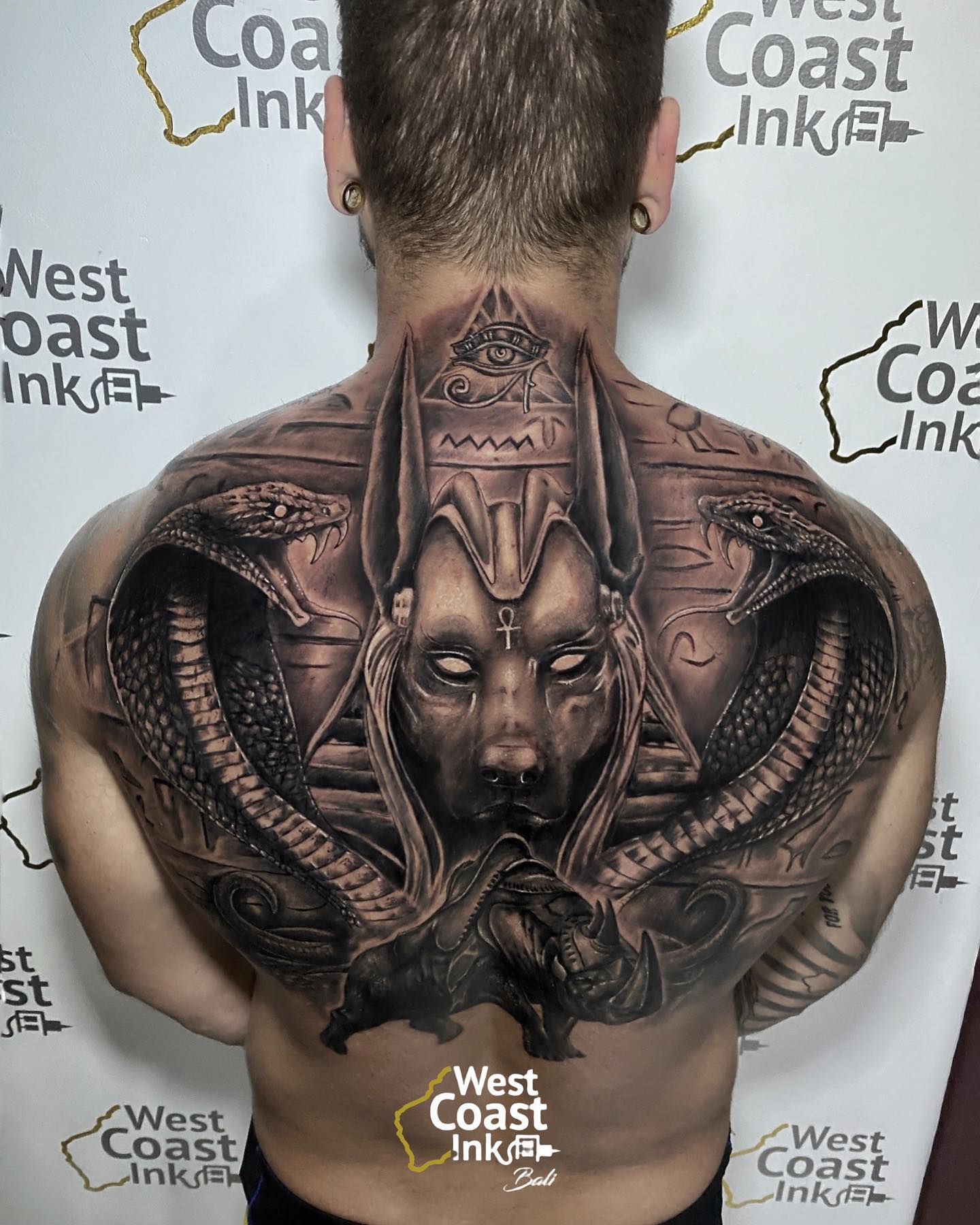 Along with other details, this tattoo will turn your back into an art piece.