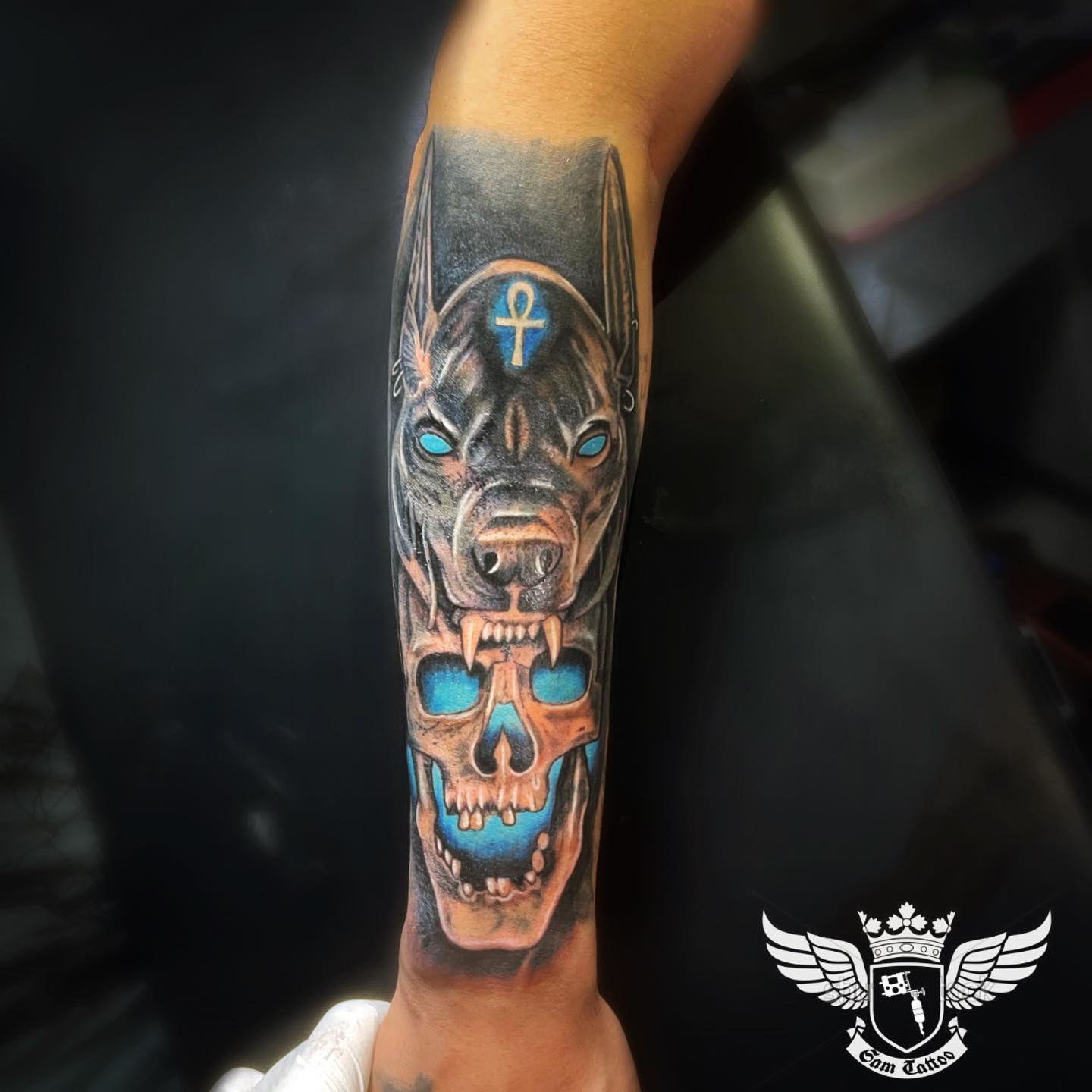 Skull and blue vibes make this Anubis tattoo amazing.
