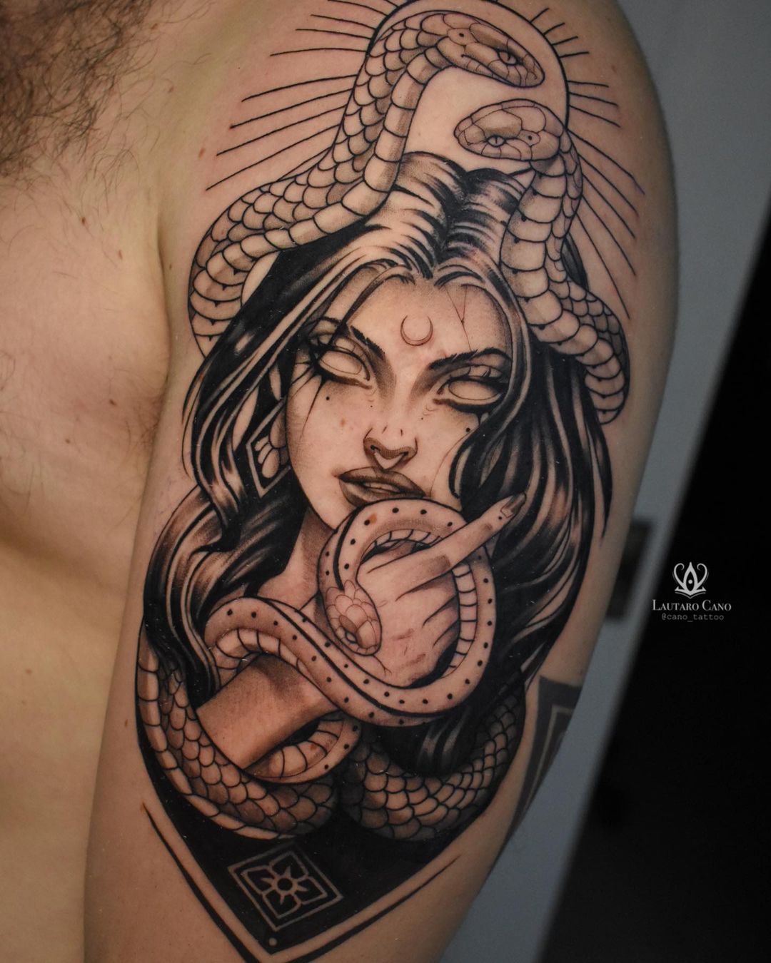 Intricately Intertwining Snake Tattoos Using Black and White Ink