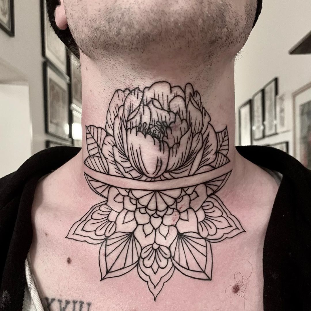This detailed neck tattoo will look amazing on younger men who love to follow trends.