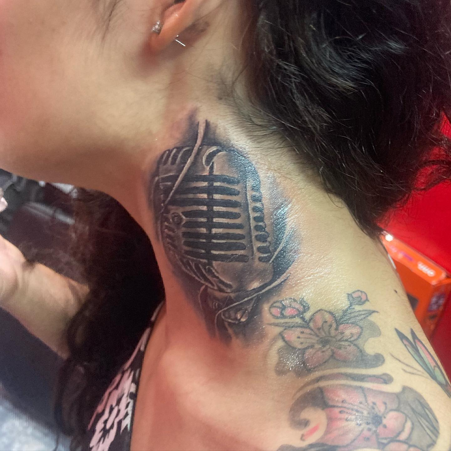 This old school microphone tattoo on your neck will inform everyone that you are a pure singer.