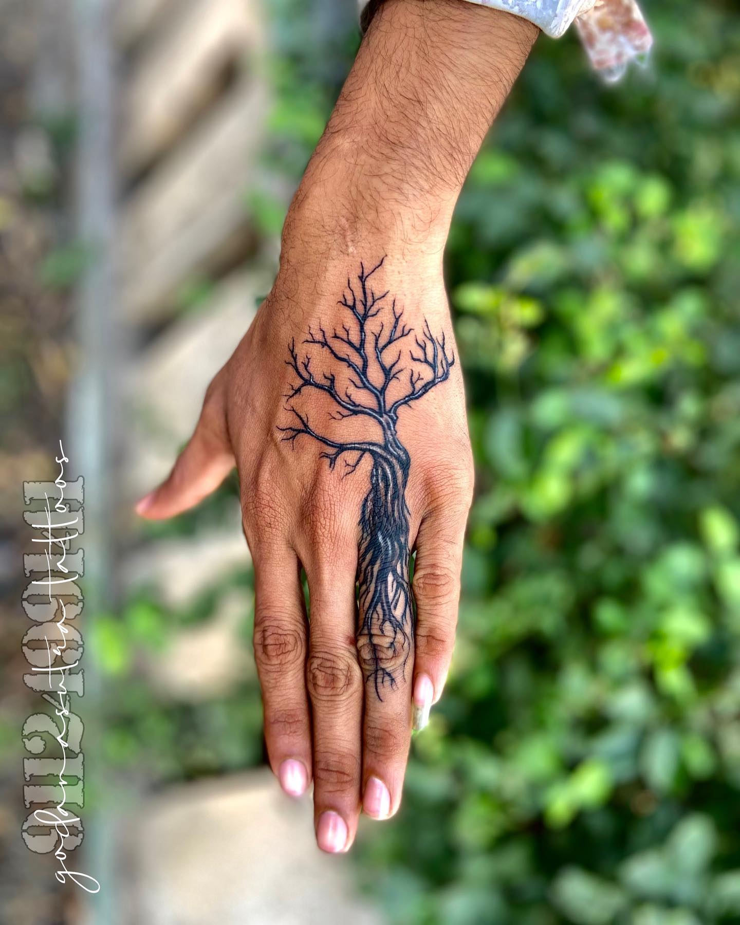 tree with roots on hand tattoo