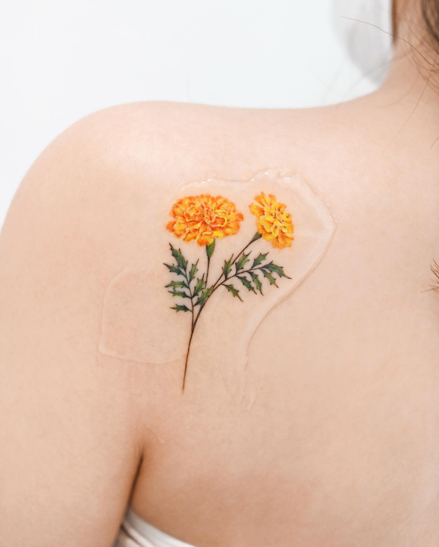 30+ October Birth Flower Tattoo Ideas: Cosmos & Marigolds - 100 Tattoos