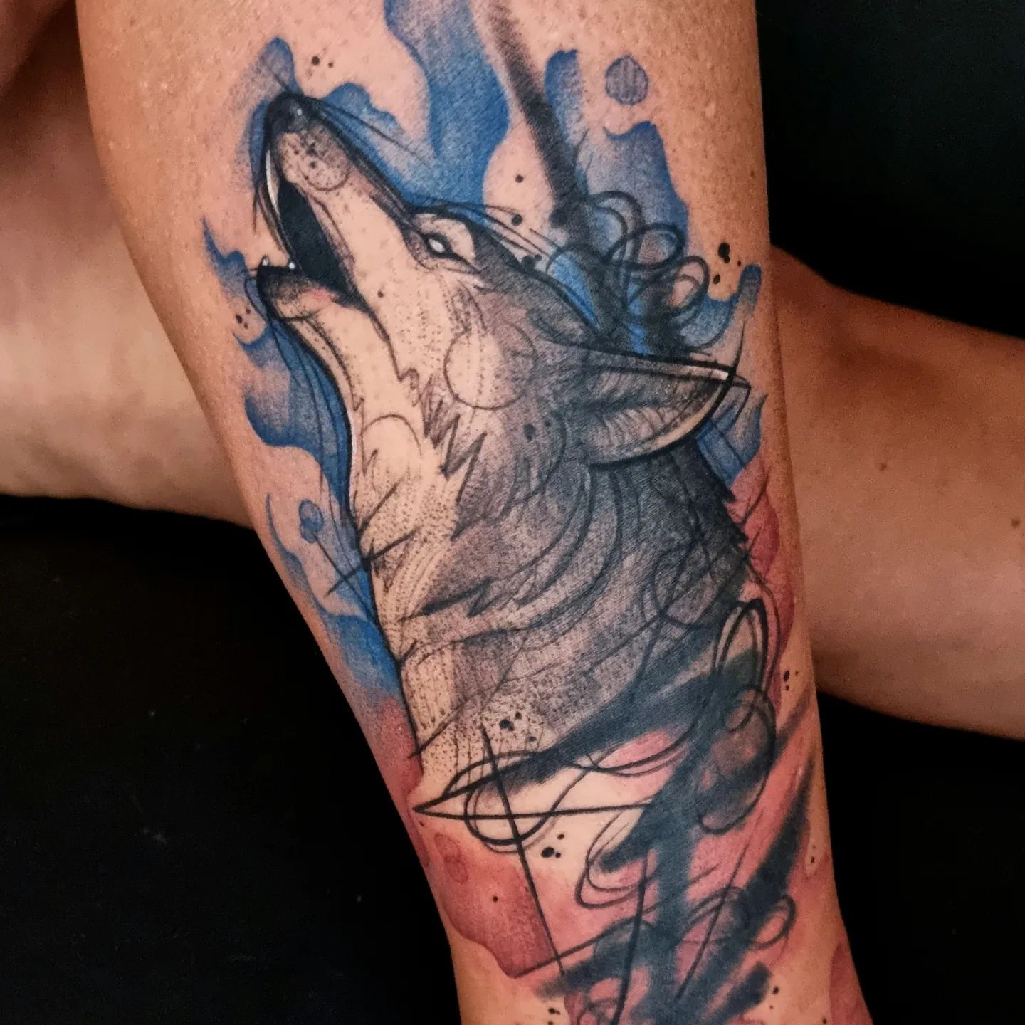 Generally, wildness is the first thing that comes to mind when thinking about a wolf tattoo. But this elegant wolf with blue vibes will break taboos.