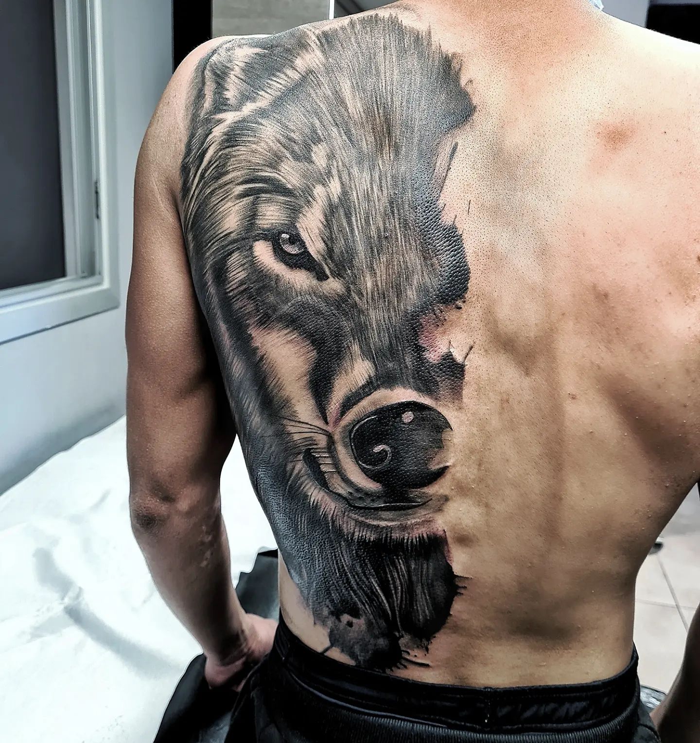  This gimlet-eyed wolf tattoo will watch your back.