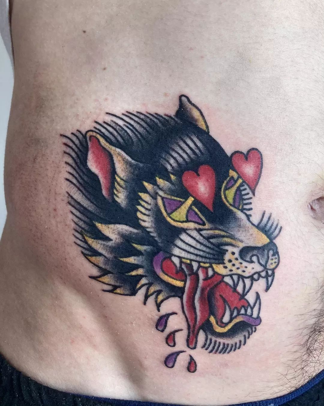 Eccentric wolf tattoo with heart-eyes will be a perfect choice if you want to get an extraordinary tattoo.