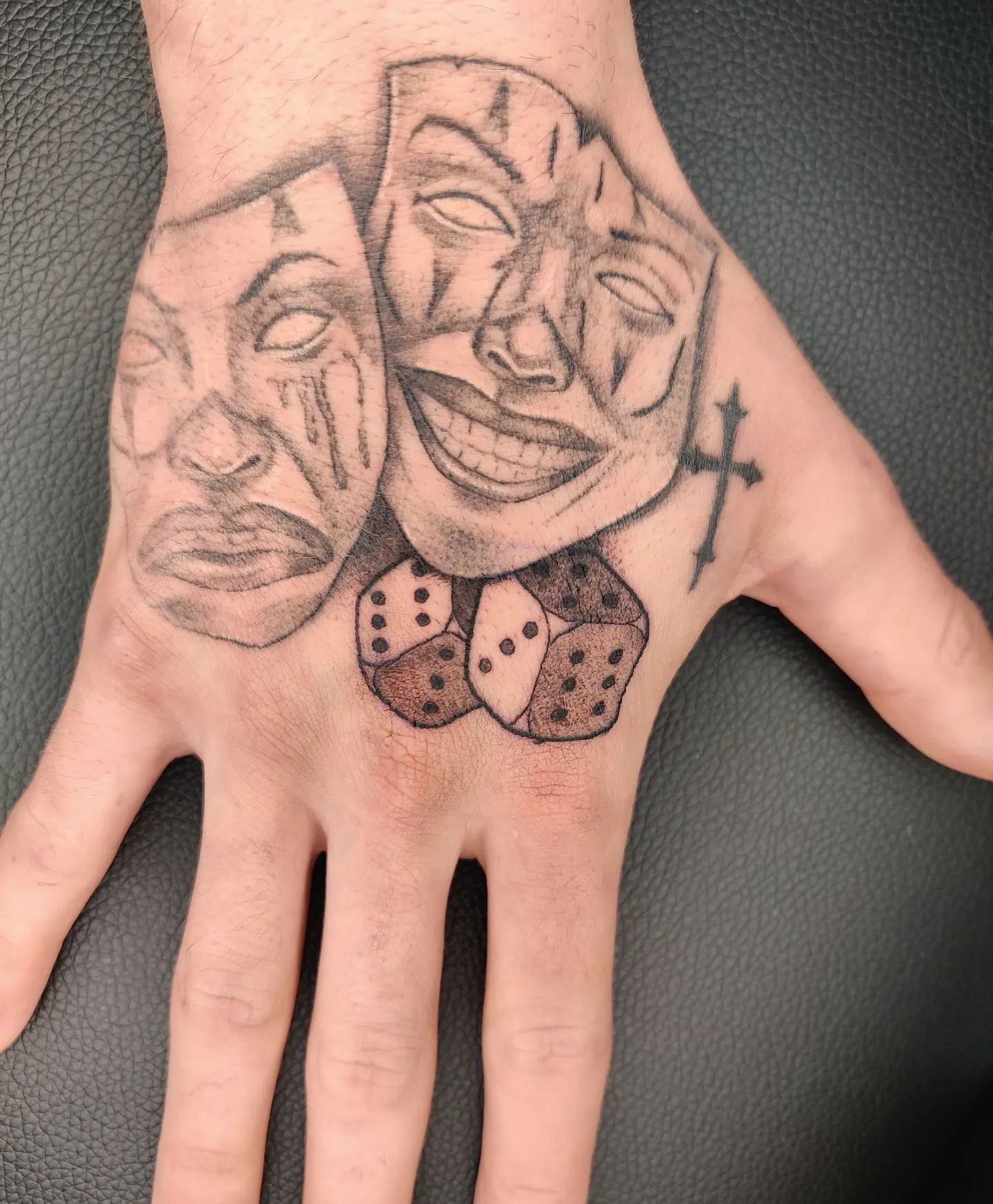 hand rolling dice tattoo