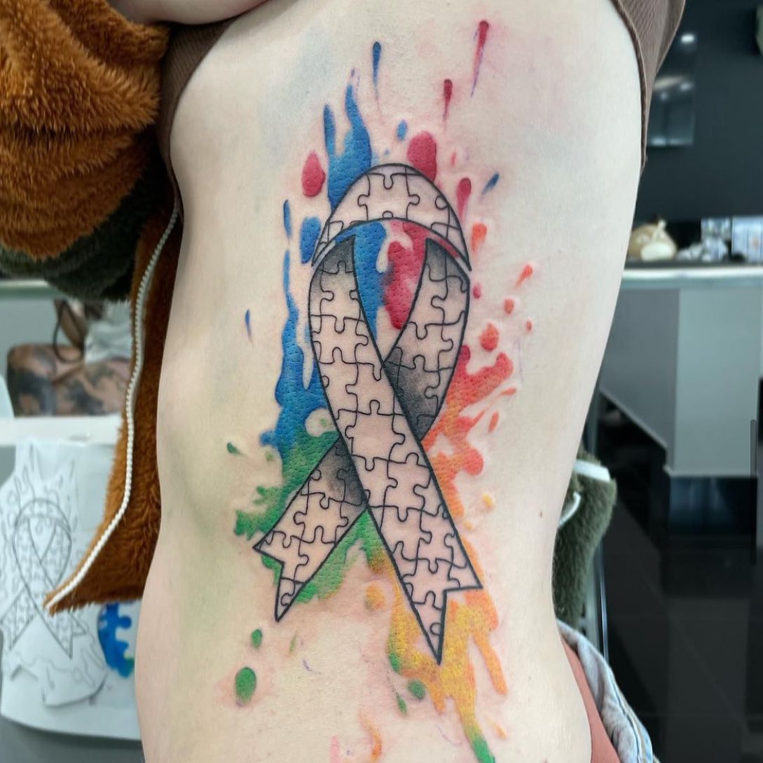 This stomach tattoo is for those who want a pop of color, as well as those who have been through something tough or rough in their lives, yet have managed to stay positive through it all.