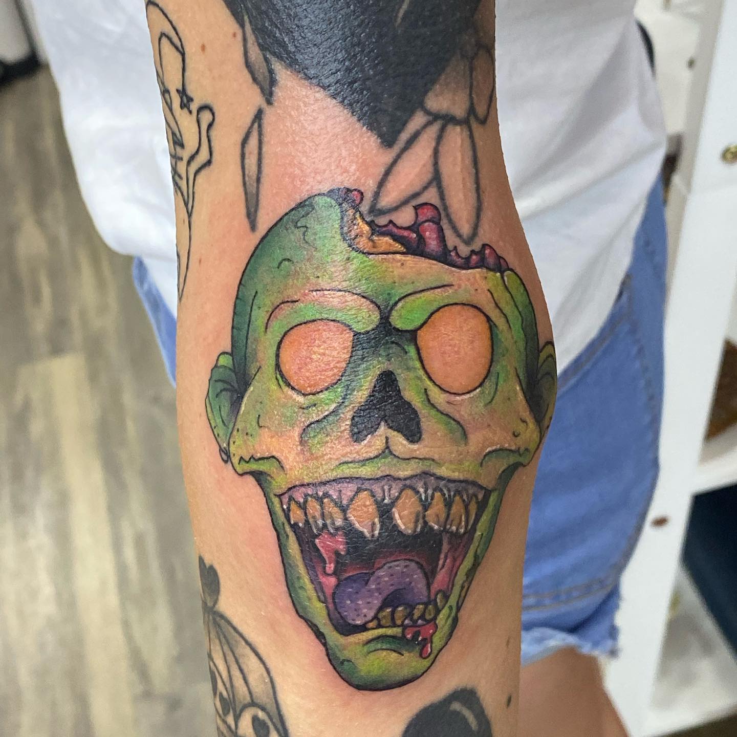 A loud green skull/ghost tattoo such as this one is for guys who are bold and determined to succeed in life. If you have overcome a fear of some sort, this will symbolize it and your success.