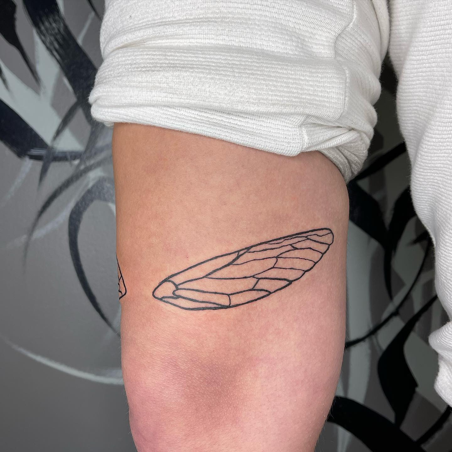 Guys can also try out this small wing pair. This design will show that you’re always ready to commit to any new situation that comes your way. If you’re an open soul, someone who likes to explore and try out new things, why not tattoo this wing? It is a quick and easy print, often a must-do for those who enjoy minimalism and those who like to keep things private.