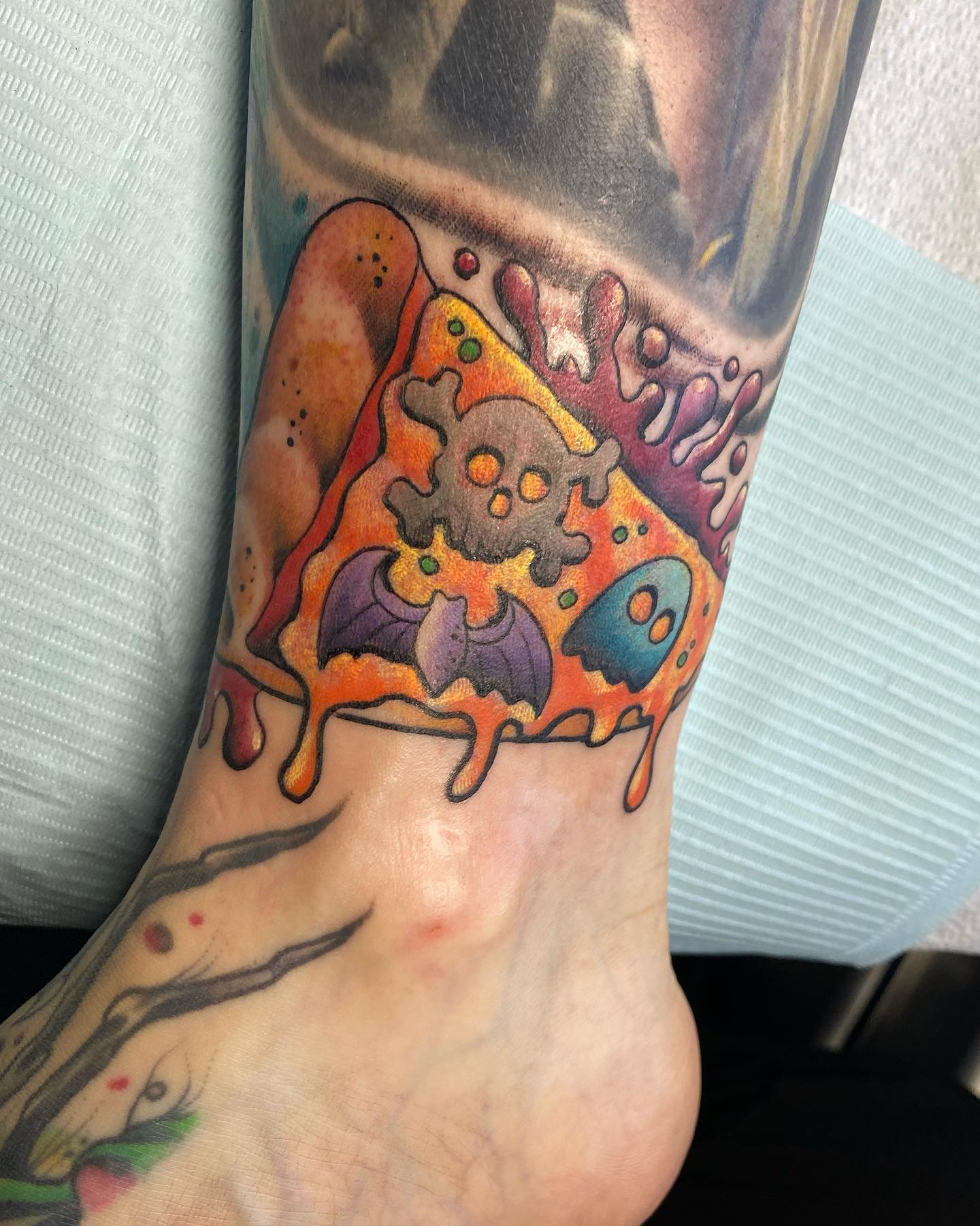 Bright, wild, and colorful ankle tattoo such as this one is for anyone who enjoys pop art and loud ink. Heads up since bright and loud tattoos such as this one can be tricky, pricey, and time-consuming to get.