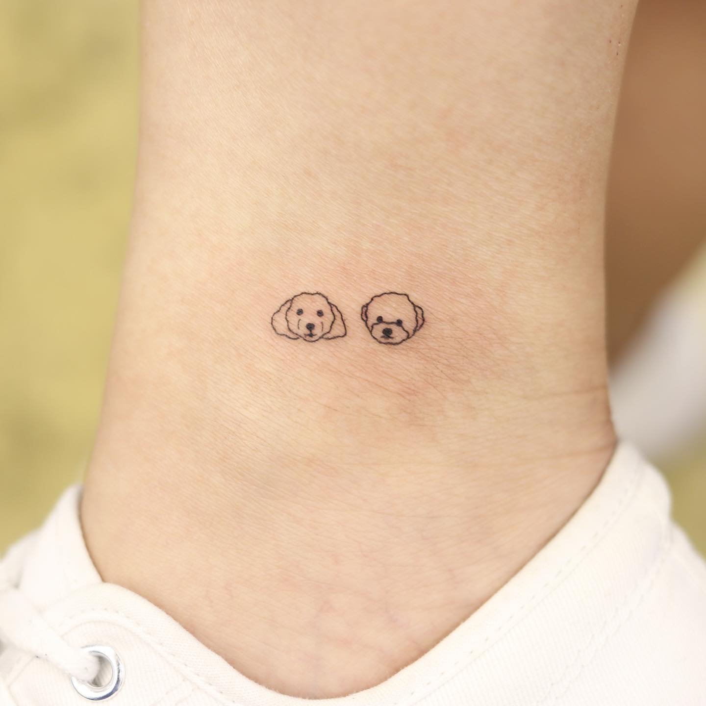 Do you have pets that you truly love and you wish to dedicate a tattoo in their favor? Show that you truly love them and that they’re your favorite little furry pals in the world with this small and cute minimalism idea.