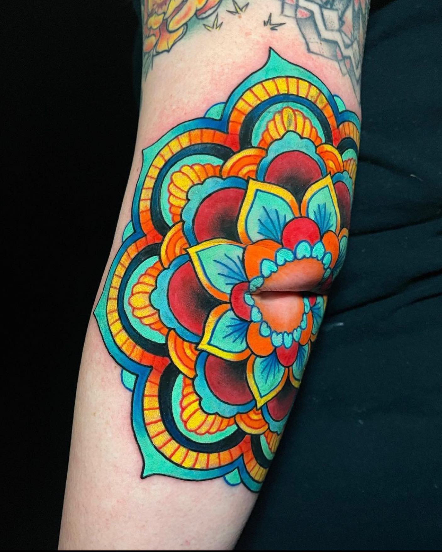Bright mandala tattoos are for those who are creative and naturally driven by nature, as well as their surroundings. Show off this color combo if you have a detail-oriented side.