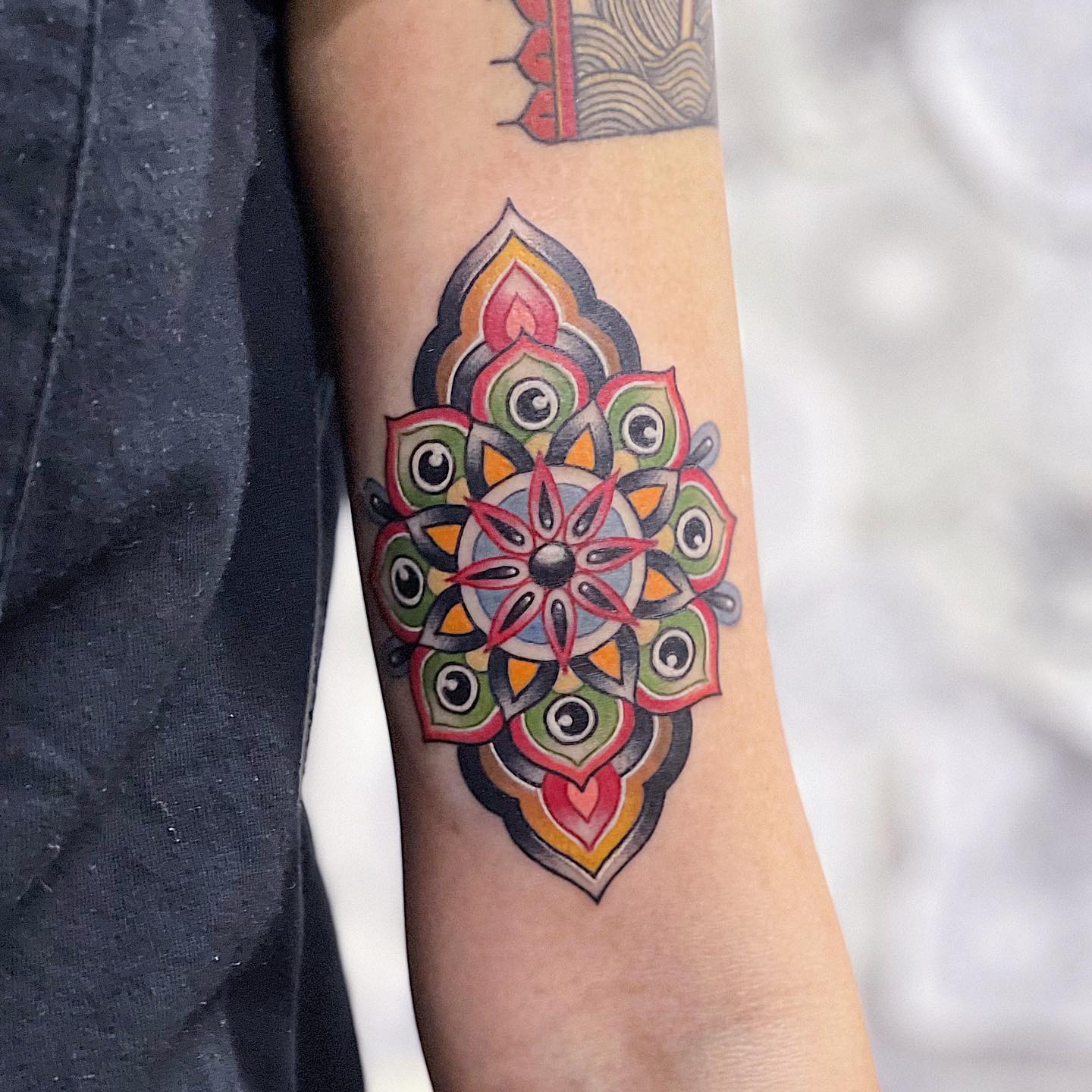 Red, green, and yellow colors stand for bright and optimistic nature. If you’re a fan of louder tattoos and you want yours to stand for creativity, positivity, and your quirky character, try out this tattoo.
