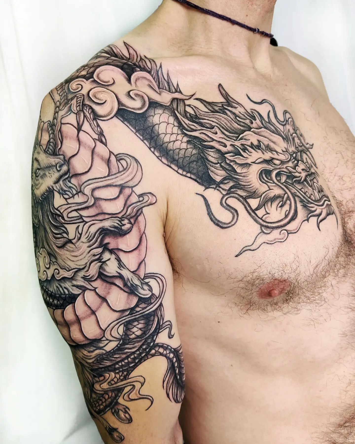 Show your persistency and your dominant bold side with this giant dragon tattoo.