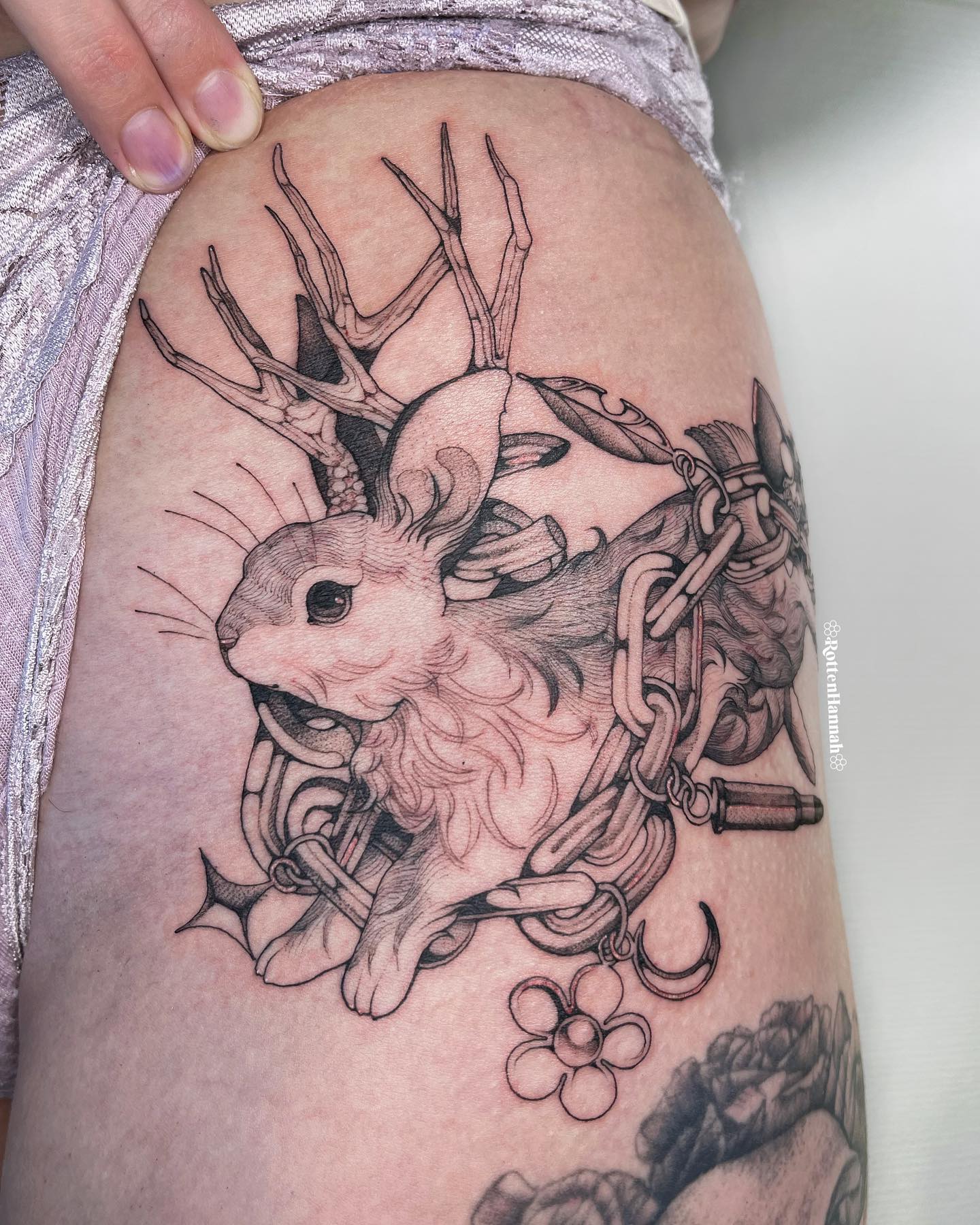 Cute black and white rabbit tattoo that will look cute and playful. If you’re into larger ideas and you want to try out something that is nature and pet-inspired, this is it.