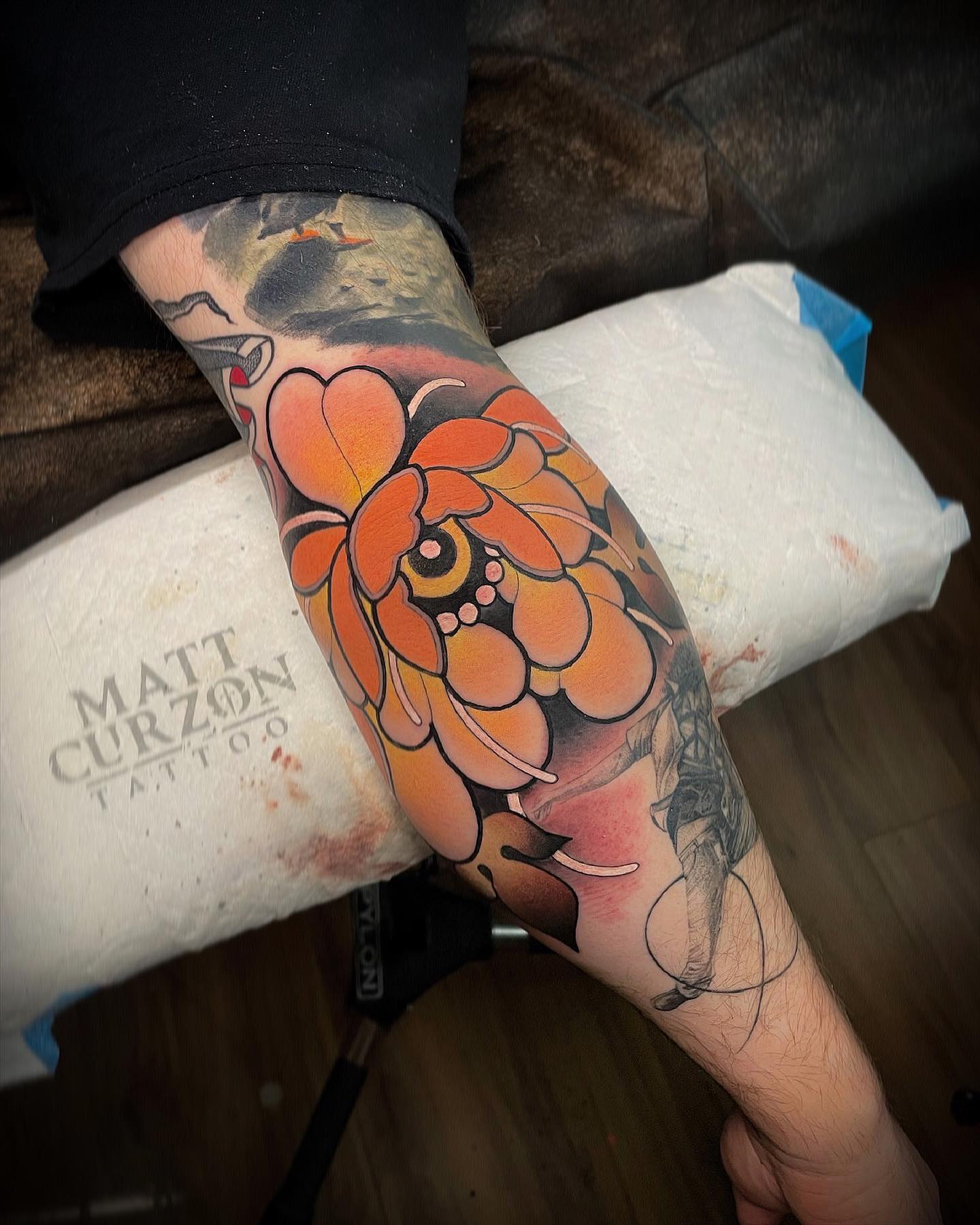 This is a bright flower tattoo that one can interpret however they like. You may be someone who likes loud colors, and on the other end, you may be someone who prefers to have feminine designs. In the end, it all comes down to your outlook on life.