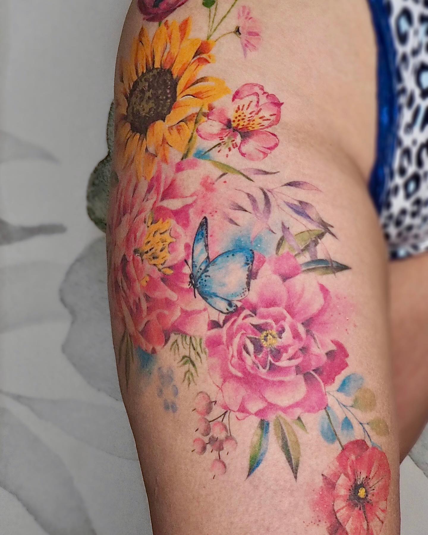 Why not go all out with this hip design? It is a fun and colorful, as well as a vibrant story that shows a fun, loving, and bubbly personality. If spring is your favorite season this tattoo will suit you and will stay true to your heart/identity.