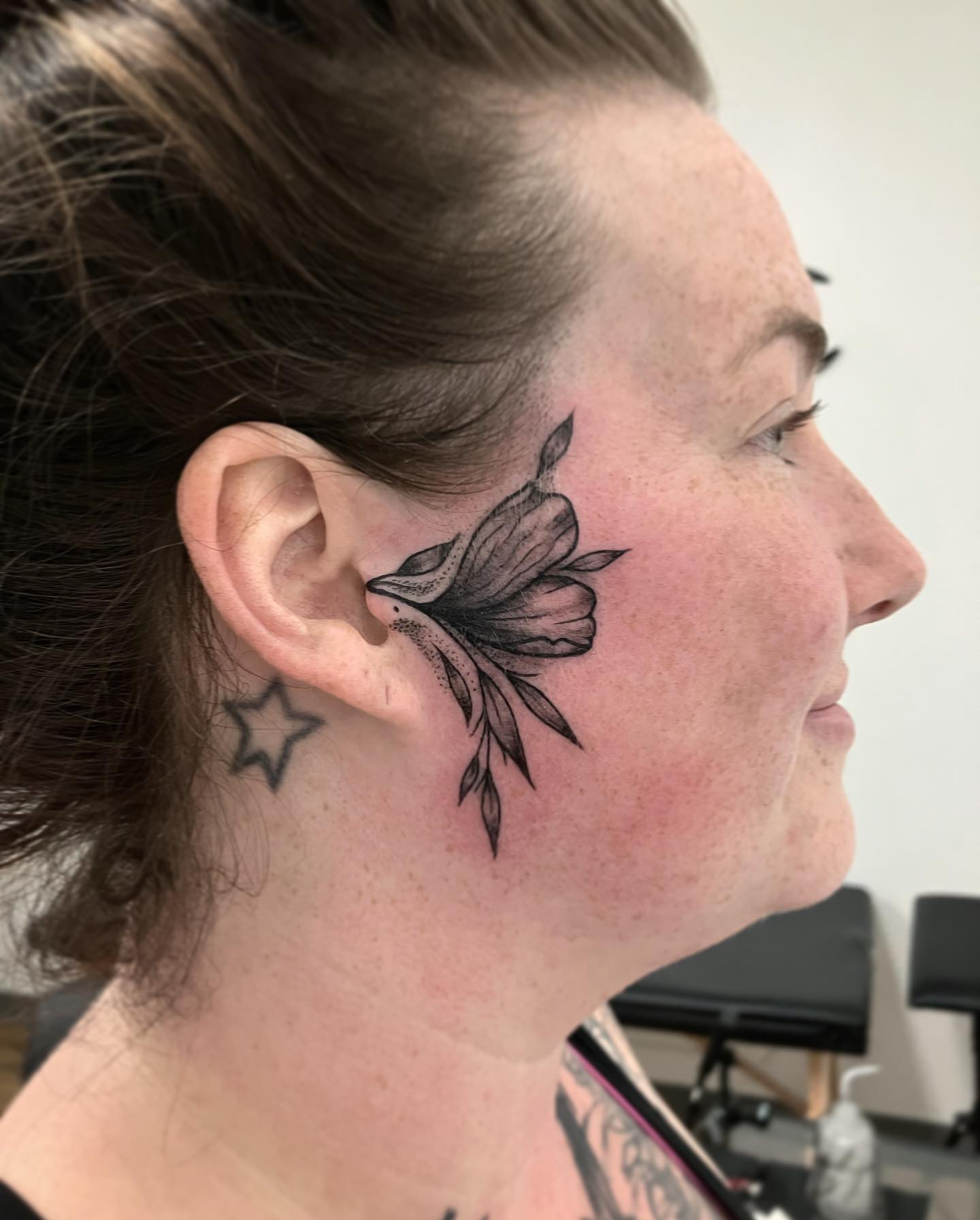 If you feel as if someone is whispering to you all the time and you believe that you have your very own positive guardian angel, this black ink tattoo is for you.
