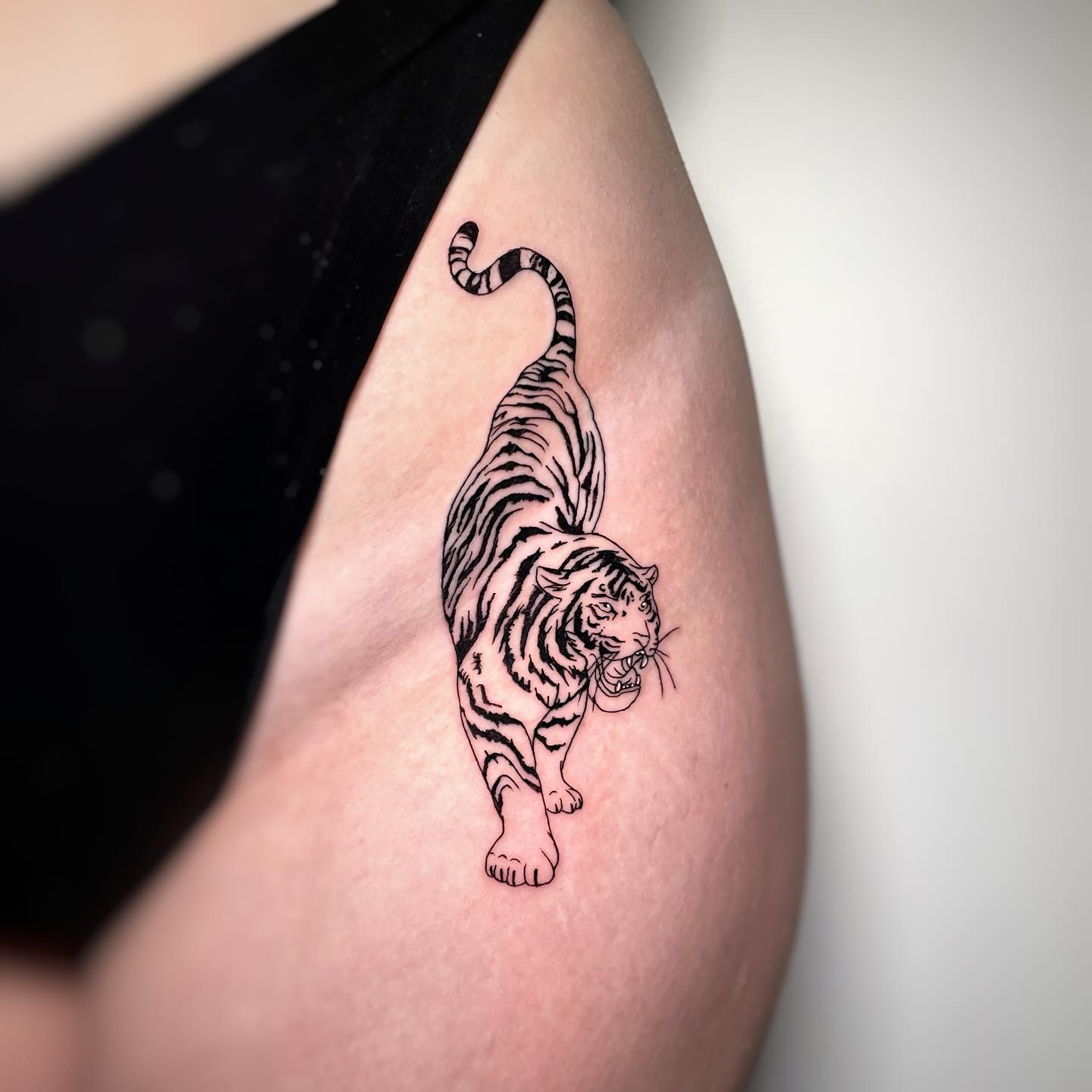 If there’s a tiger within you and you’re a fierce girl who likes attention, this tattoo is for you. Show that you know how to attract both looks and attention with this stylish yet feline-feisty design.