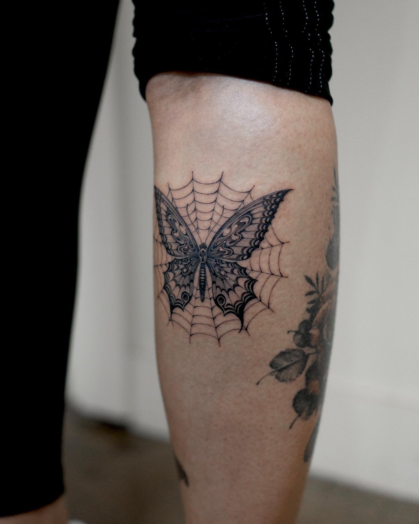 A spider web tattoo that has a butterfly in it will show both dedication and a strong will to get through any tricky situation in your life.