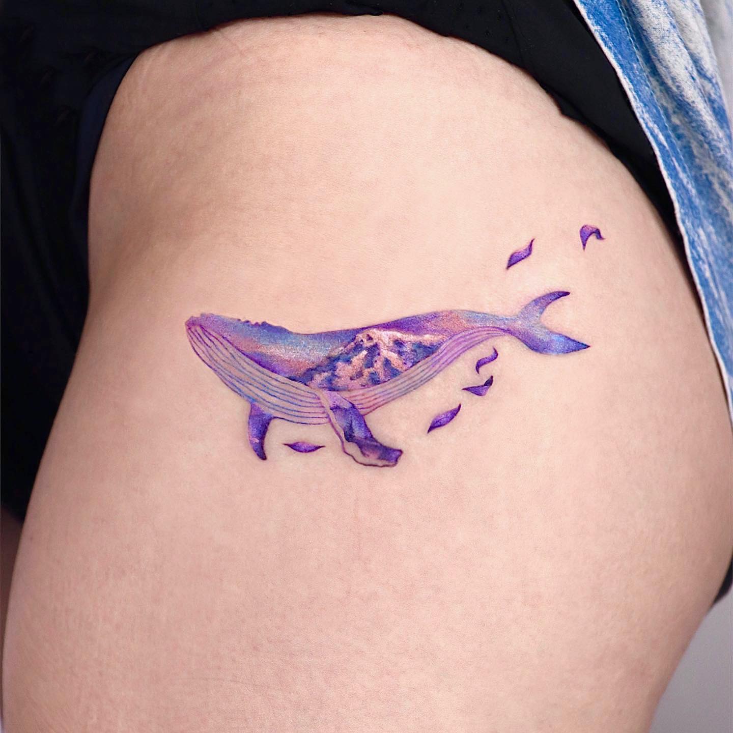 Small and cute, this purple whale tattoo on the hip is for women who like minimalism. Show that you’re all about wildlife with this cute little cheerful piece.