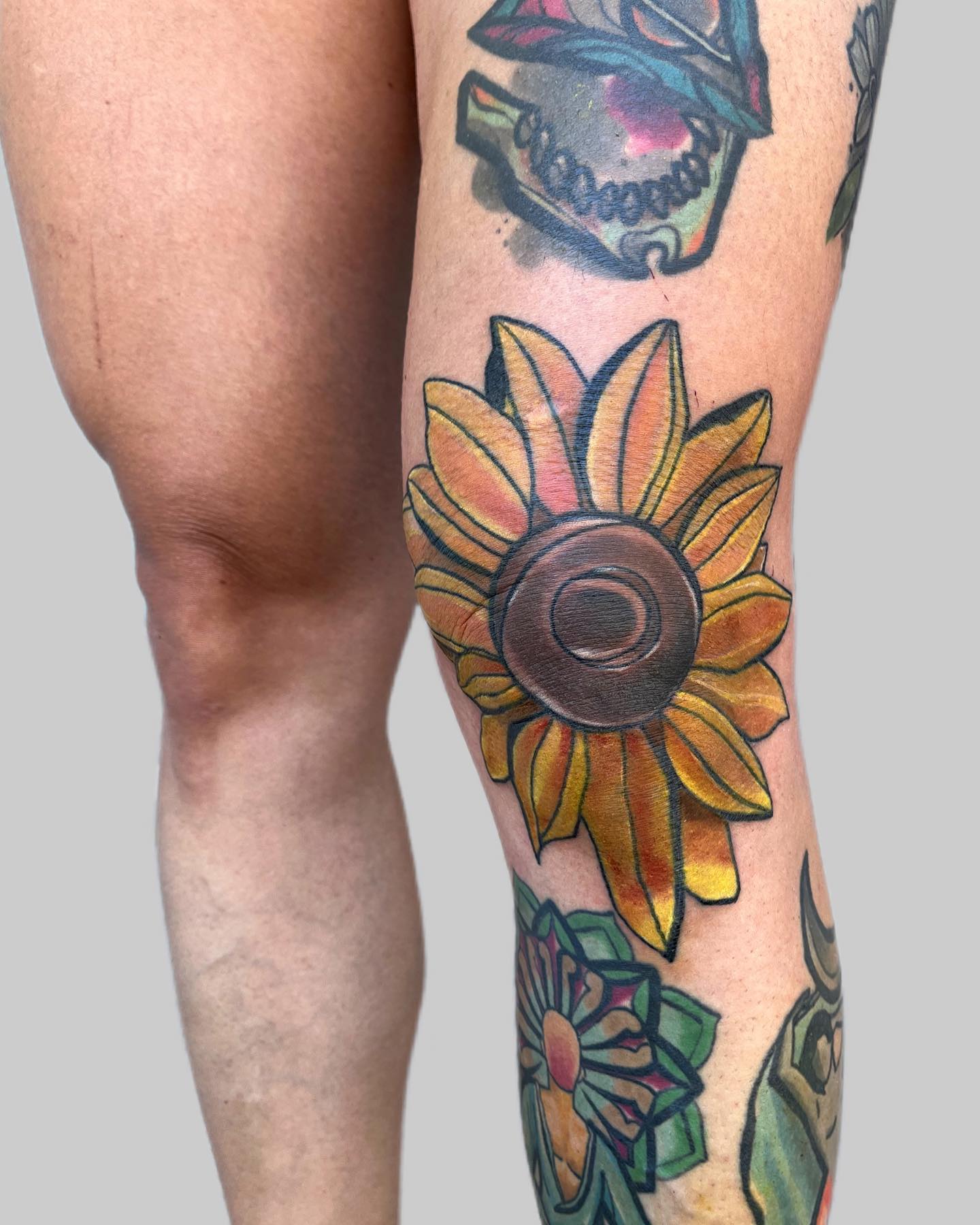 Sunflower tattoos are a common design by both guys and girls. This design symbolizes fun and calm spirits. Guys who love the summer season will also like this yellow flower the most. If you know of someone who is a sunflower or who you love dearly, this is for you. Want to dedicate this design to them?