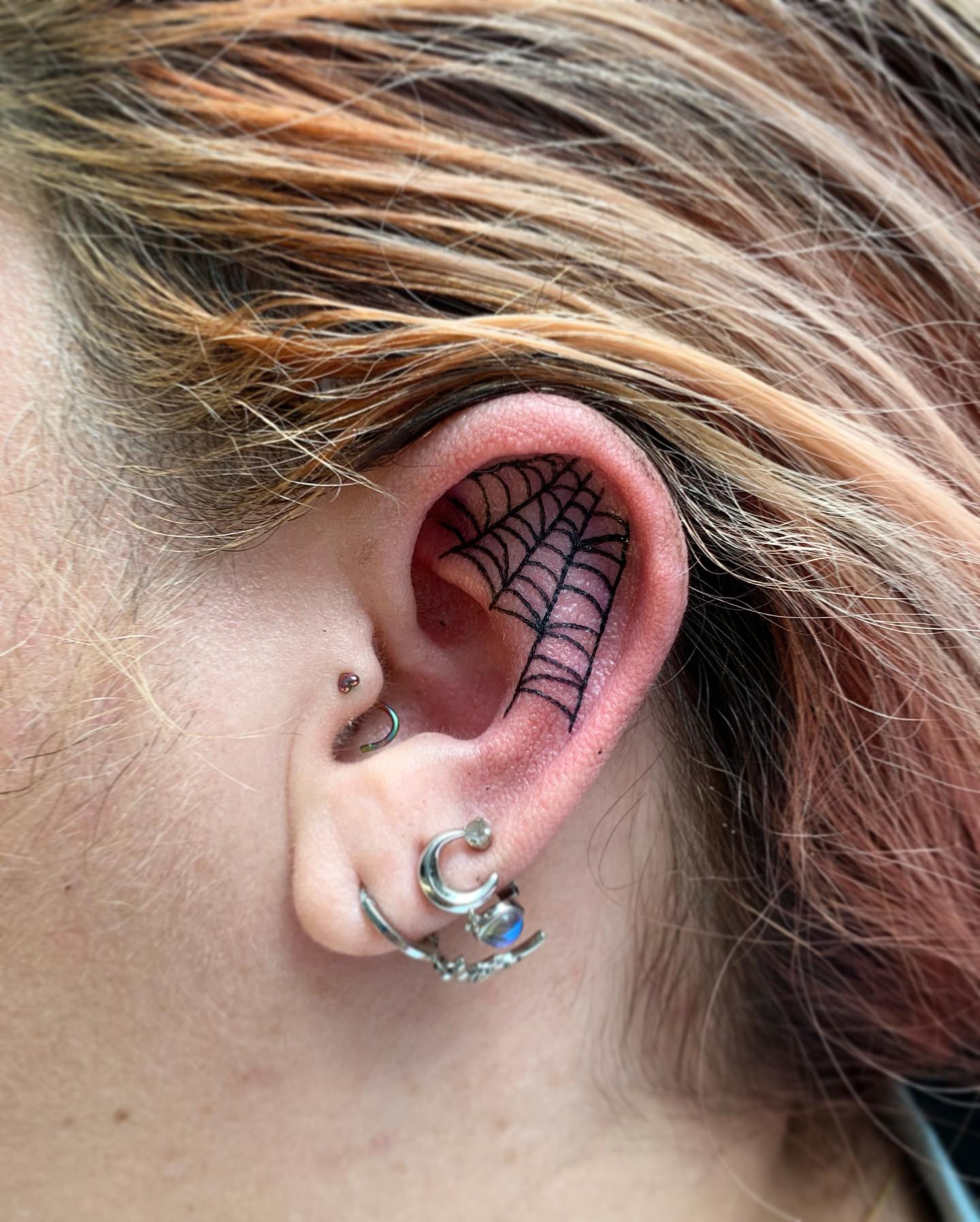 An ear tattoo and ear placement are something bold to go for. If you can handle the pain factor, this design is for you.