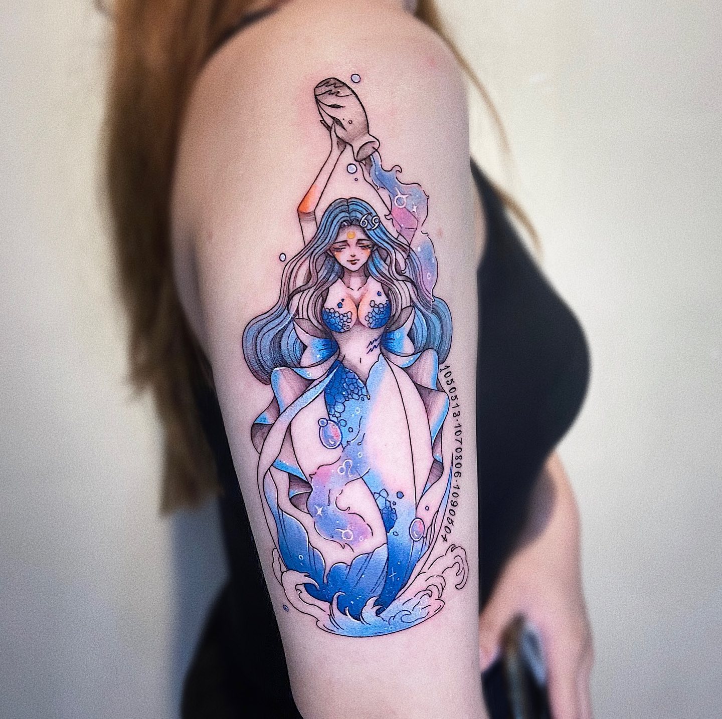 A colorful Aquarius woman is pouring down water from a bucket to her body. It can be one of the best tattoo designs for your horoscope. What are you waiting for?