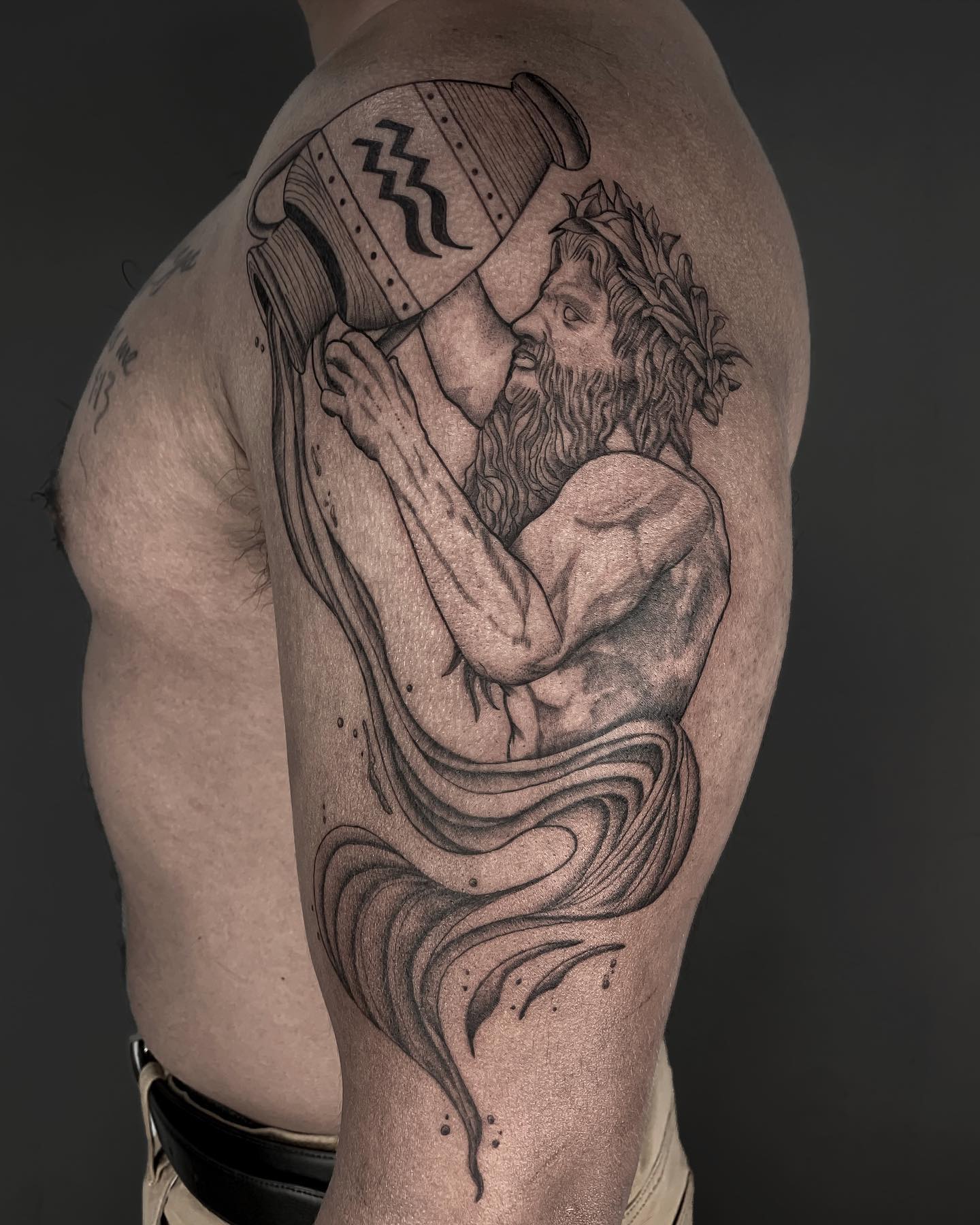 Aquarius guys will definitely love it! An ancient man, probably Greek, is carrying water to his people. Being a strong one, this man could symbolize the power of man who looks after his family. Why don't you try this out? But first, you need to find a talented tattoo artist.