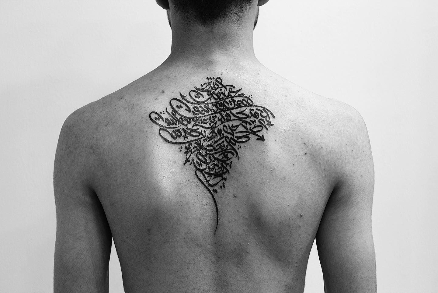 A giant back tattoo in Arabic is sure to make you stand out from the crowd. It looks super-complicated and you need a talented tattoo artist for it.