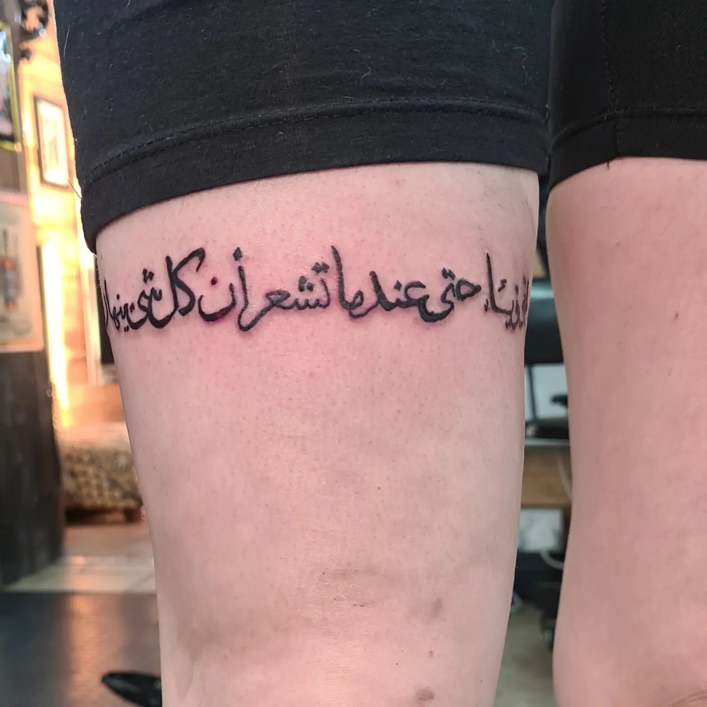Cover all of your upper leg with Arabic lettering. When you wear shorts and skirts, your leg tattoo will look amazing.