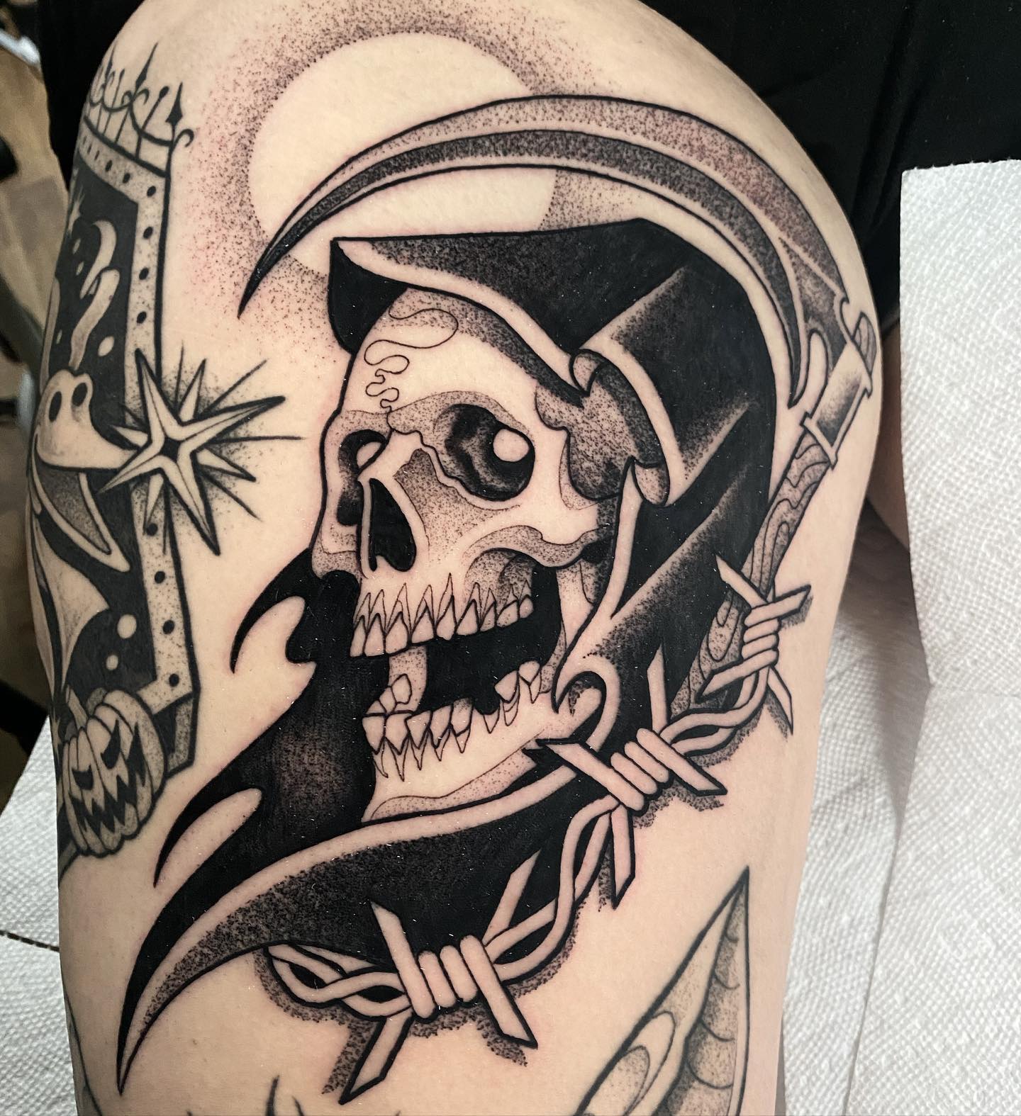 This scary tattoo may not be appealing to everyone but we know that there are lovers of it. A grim reaper is a personification of death in the form of a skeleton. It is believed to claim one's life when the time comes. To make it look scarier, a barbed wire can be added to its knife.