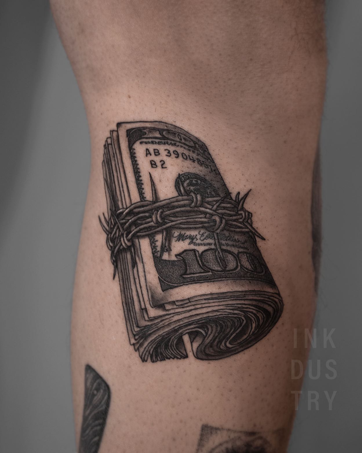 Bankrolls make everyone get excited because who does't like them? In this tattoo, however, a different meaning is on the stage. People are crazy about money and they sometimes let it buy their personality. In order to show your disagreement with this situation, why don't you get a tattoo of a barbed wire with a bankroll?