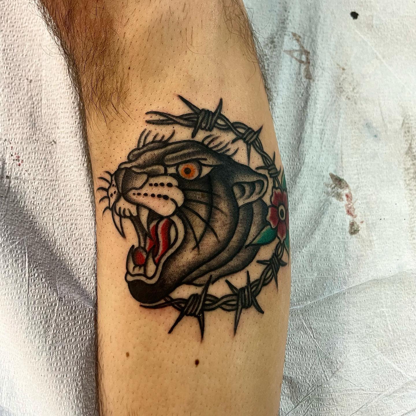 Tigers are super-wild and strong animals. They are mostly chosen as a tattoo since they offer a wild and tough look. In this tattoo, a roaring tiger is combined with a barbed wire and this is all you need to show your wild side with its protection.