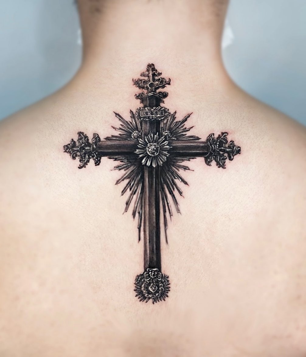 Wanna convert your back into a piece of art? Then, you should definitely get an antique cross tattoo. It looks like it comes from Middle Ages. To feel this old vibe on your back, there is no better choice. The size of it is also amazing. Big tattoo lovers and of course religious ones will adore it.