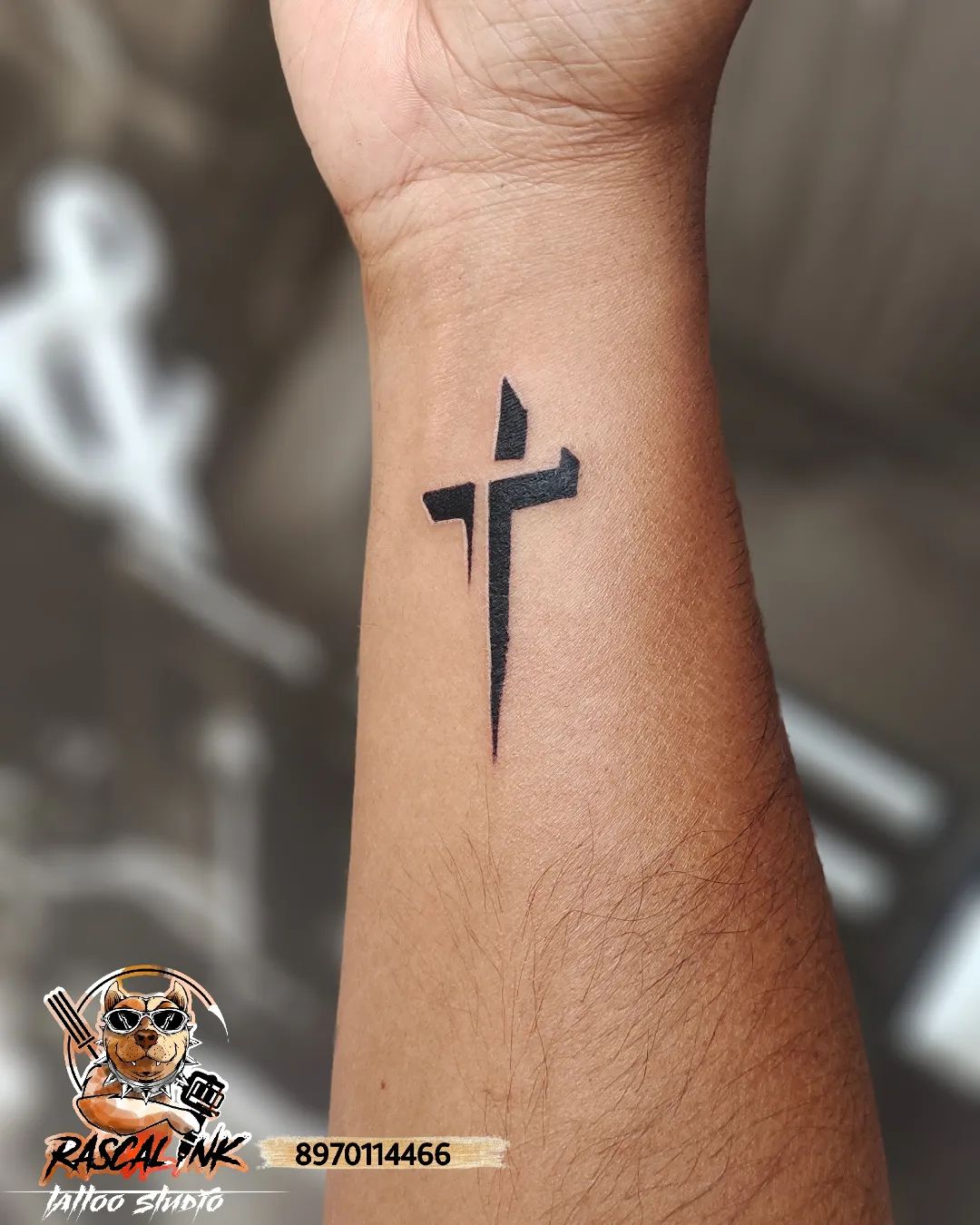 To show your love of Christianity, cross tattoos are always ready to make you feel this love. The one above is a minimalist and creative one. The shading used in this tattoo makes it look like it's dimensional. Because of the effect underside, we see the cross as stuck. Let's turn your wrist into a piece of art!