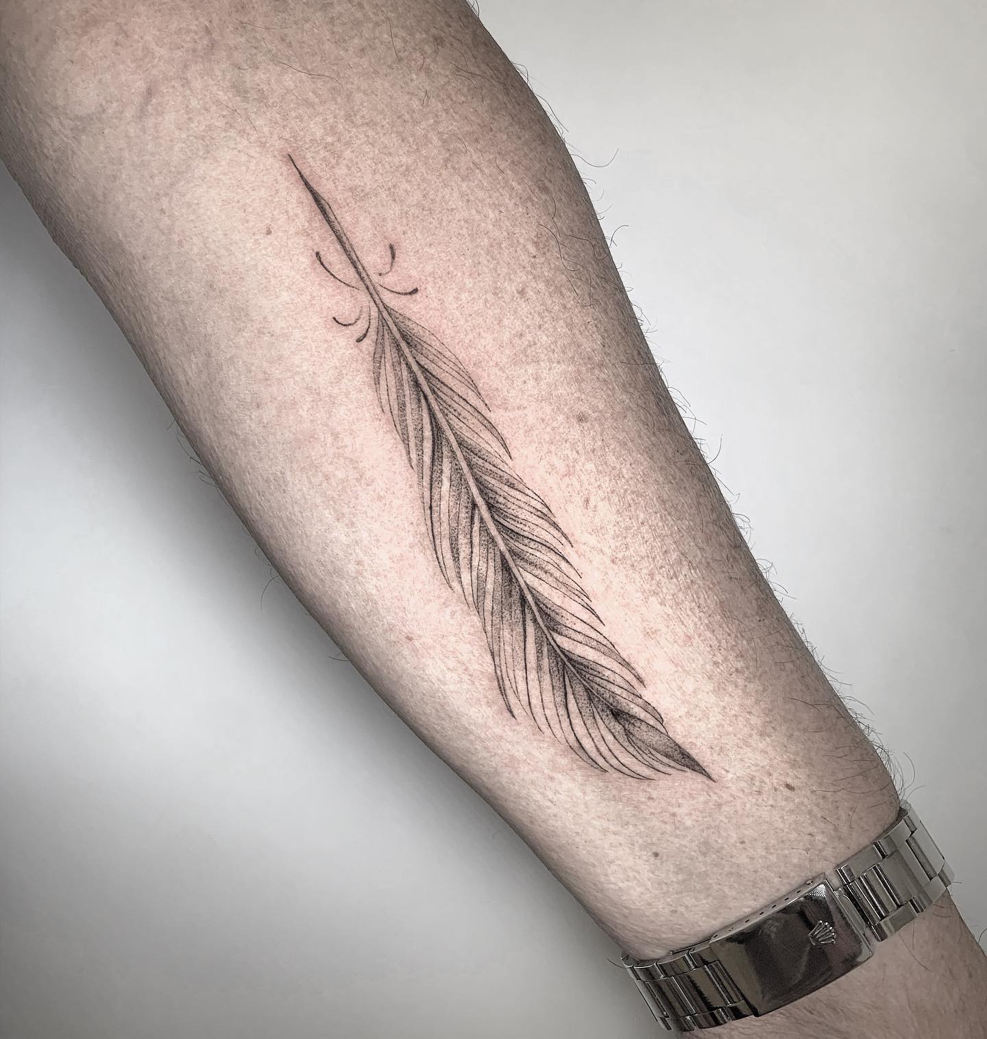 All of these lines and dots turn a simple feather into an art piece. This tattoo proves everyone that there is a perfection in simplicity.