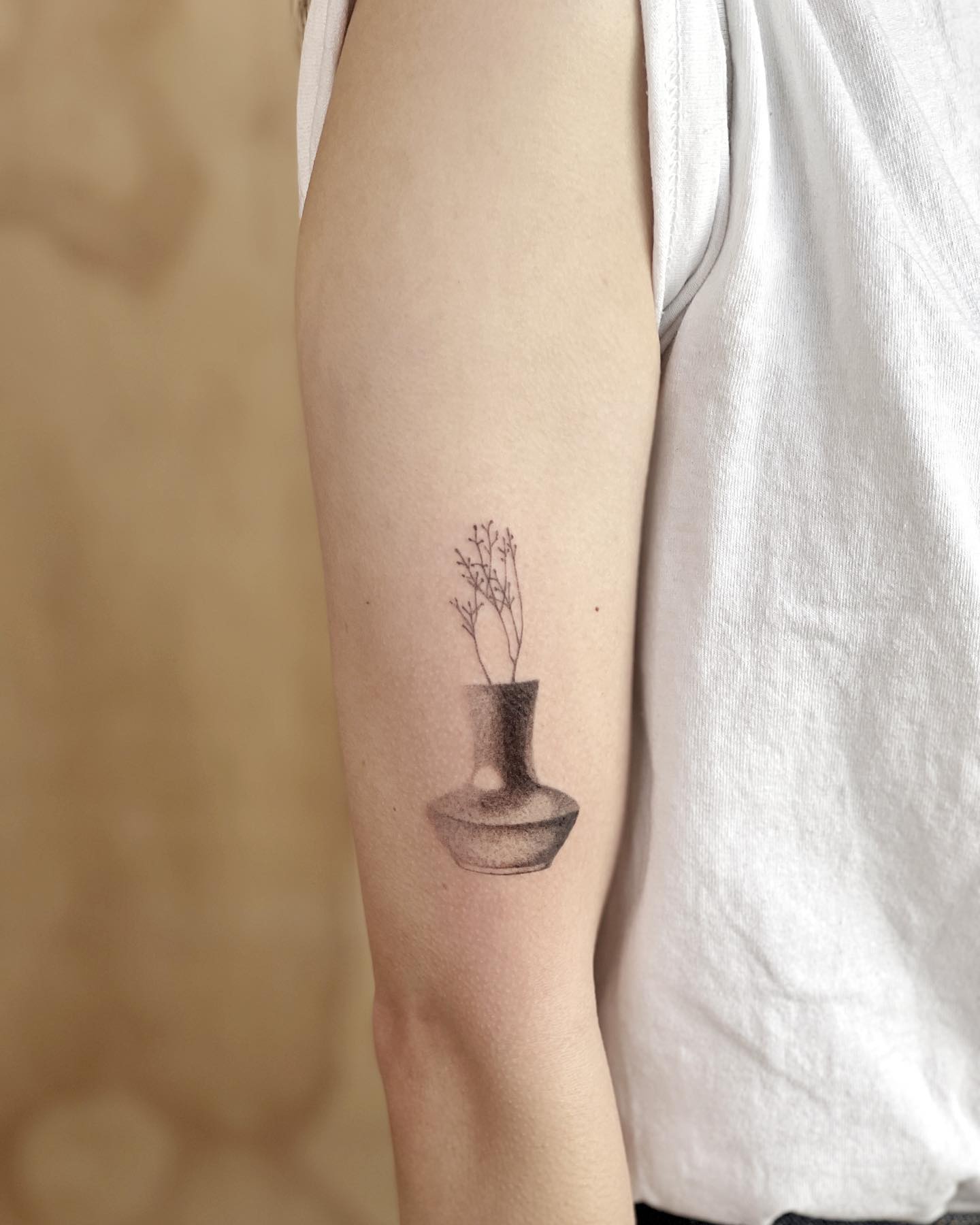 A small but detailed vase dotwork tattoo design is enough to enjoy your tattoo. Why don't you give it a shot?