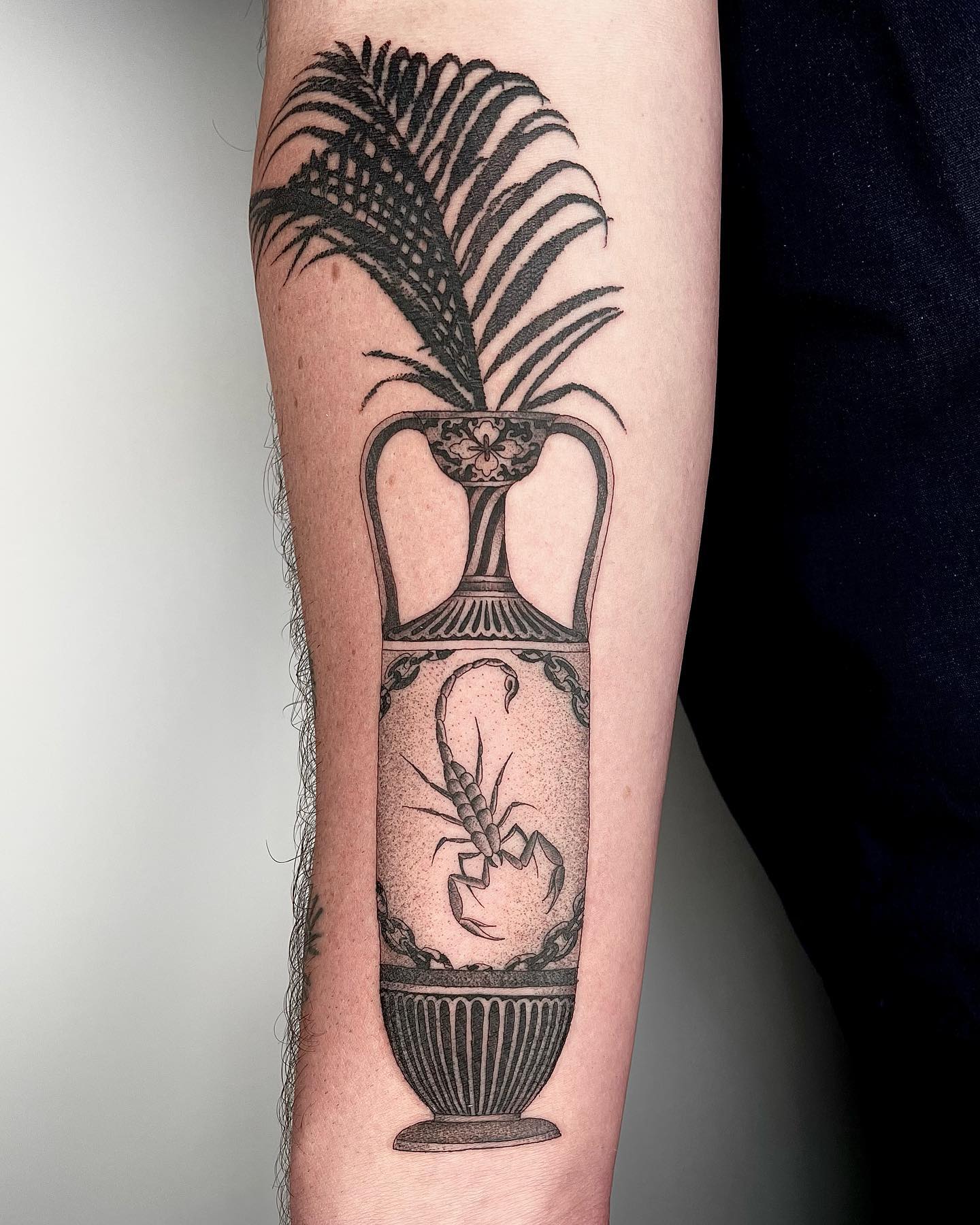Here is an interesting design for the ones who prefer unusual tattoos. A scorpion in a vase will represent that you take everything in control.