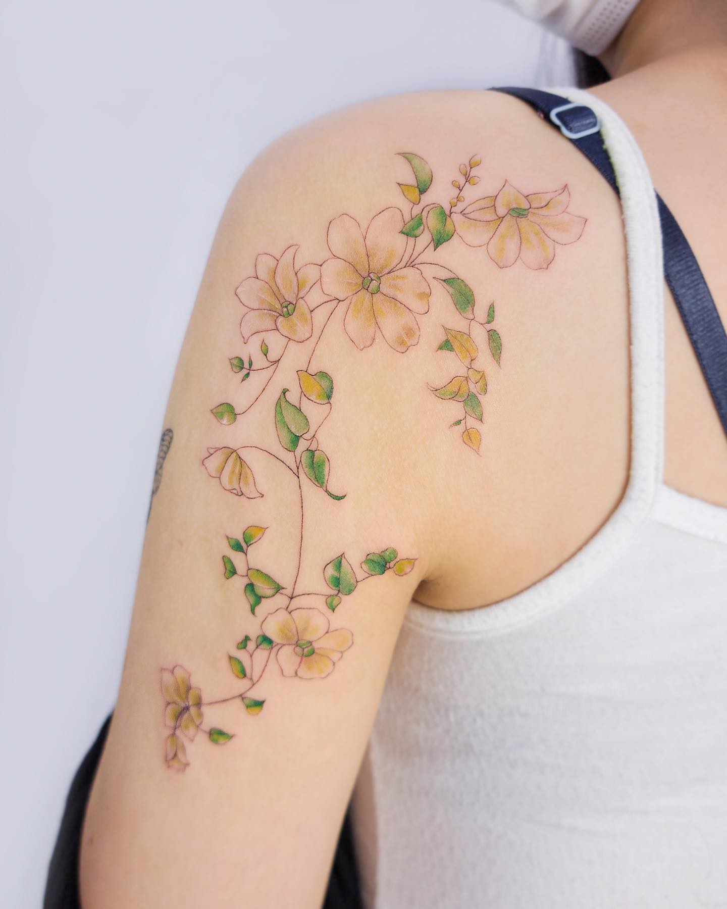 If you like floral ideas on tattoos, here is a fabulous idea to match with some leaves. A thin line is used to draw flowers and this effect looks perfect if you line this type of line artworks. Small leaves that accompany the flowers are so cute.