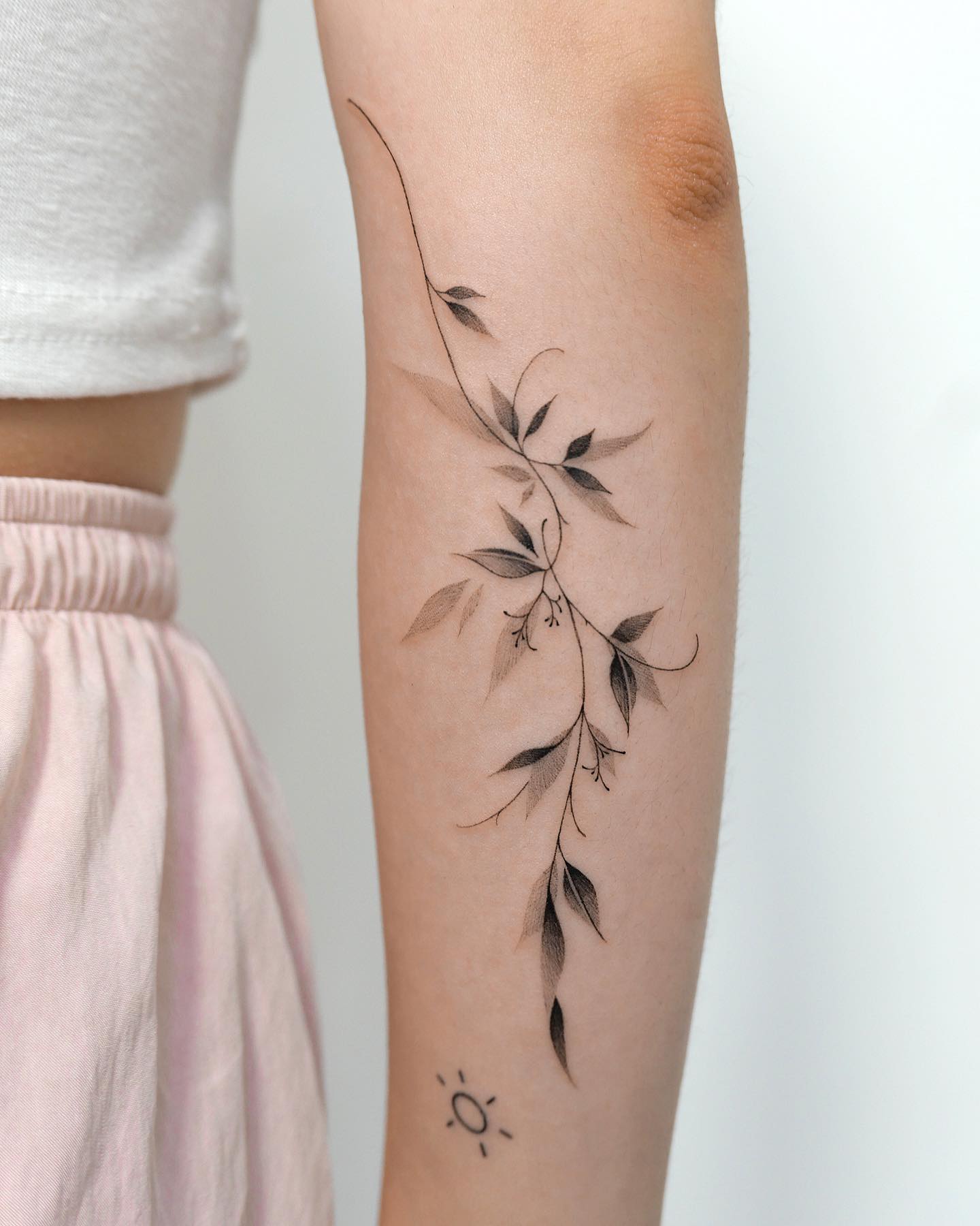 Here is another line tattoo that will amaze you and everyone around you. This black ink leaf tattoo offers a depth because of its shading details and this look is quite amazing to try.