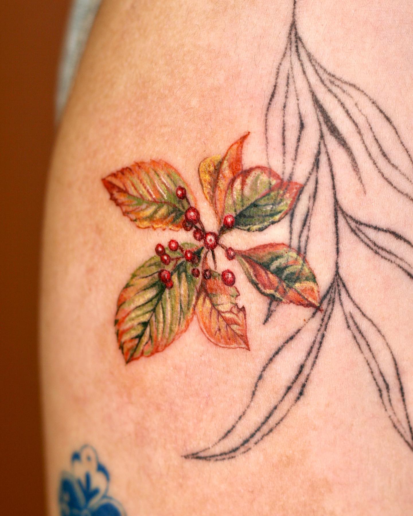 Leaves go through a beautiful change every season. Green is always a favorite but one of the best colors that suits well with a leaf is orange, for sure. This tattoo will remind you Autumn.
