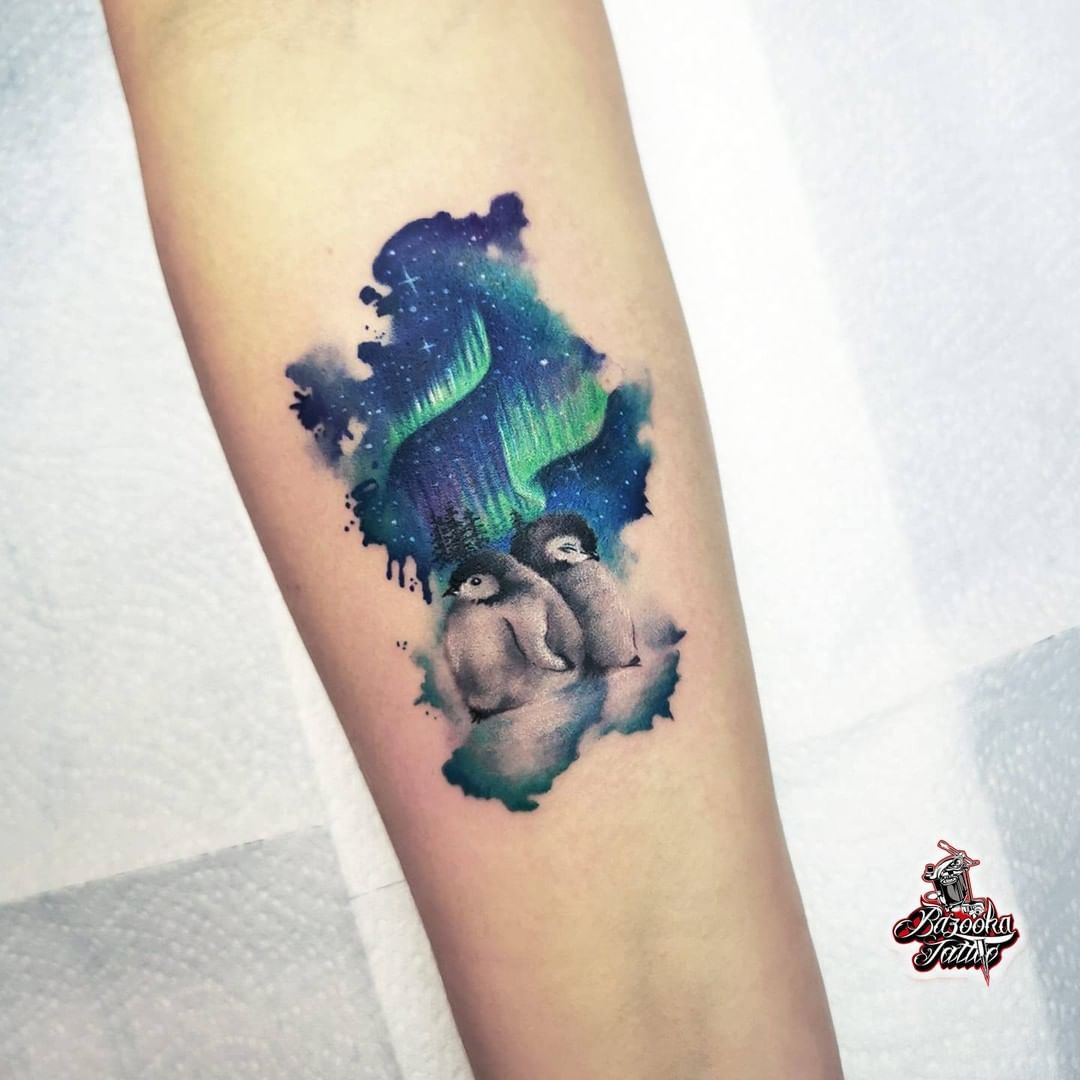 If one of your dreams is to see the Northern lights with your girlfriend or boyfriend, here is an inspirational penguin tattoo for you. Everytime you look at your tattoo, you will do your best to make your dream come true.