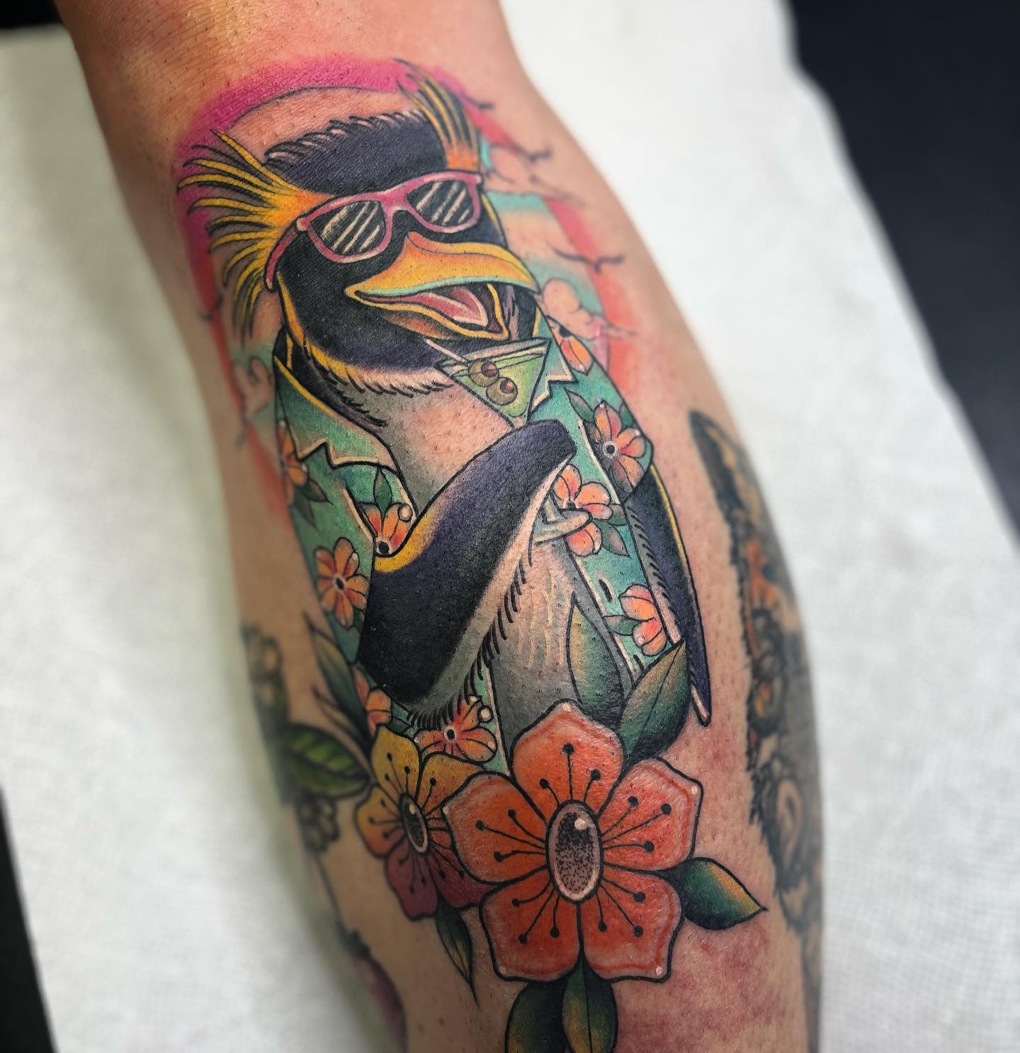 The Hawaiian vibe is all about flowers, colors and music. To reflect your love of Hawaii in your penguin tattoo, there is no better choice than the one above.