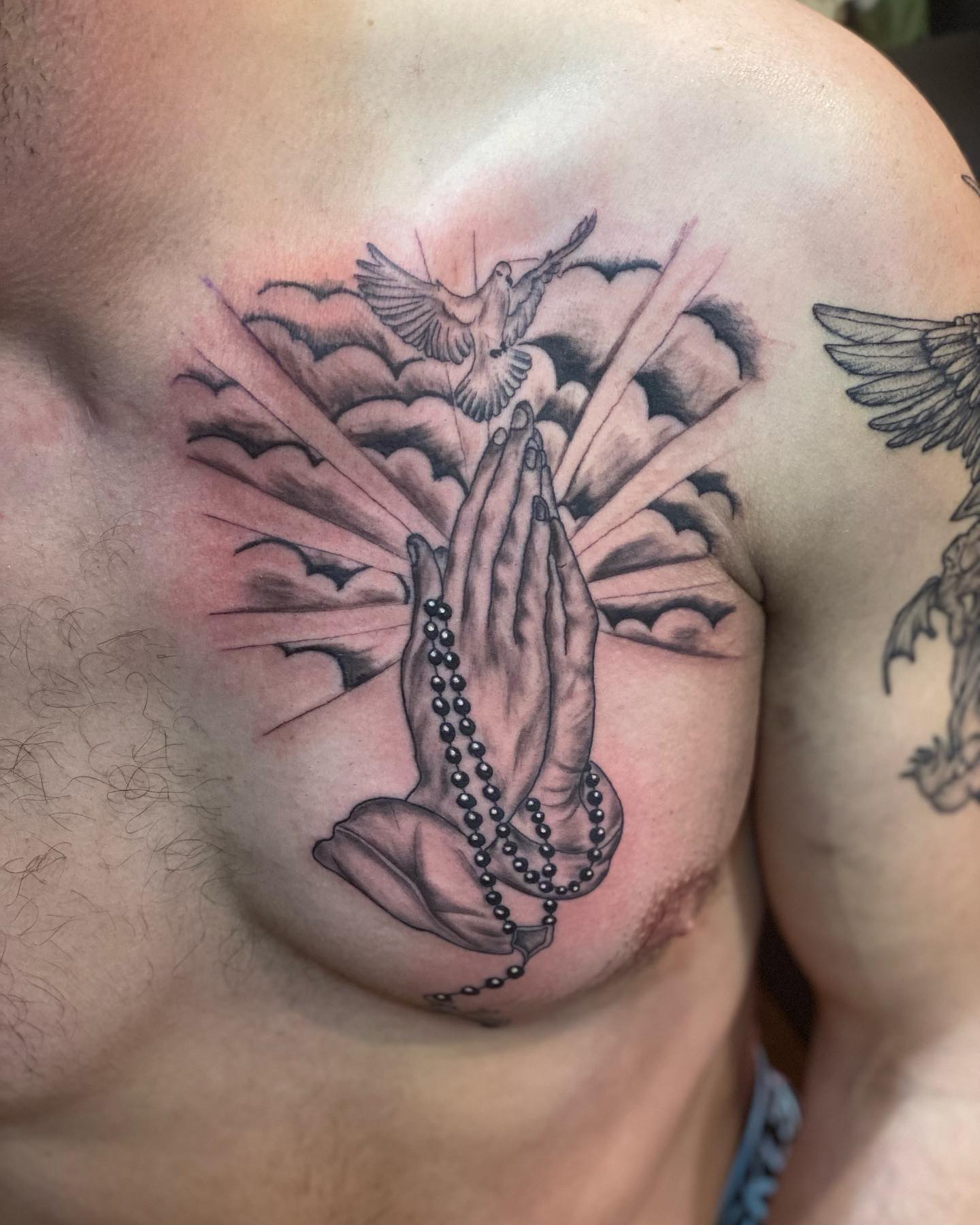 Generally, chest is the best location for this kind of mid-large size tattoos since the tattoo covers all of it. For your praying hands tattoo, this is a great one.