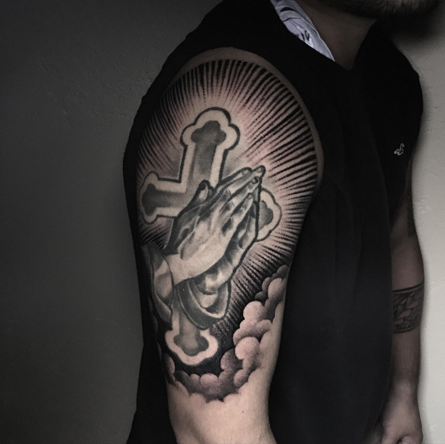 This realistic tattoo will show your devotion to your faith. A big cross will amaze everyone with praying hands on it.