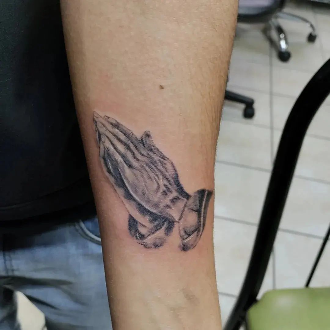 If you don't like big size tattoos, you can go with a medium-size like the one above. Shady praying hands will suit on you.